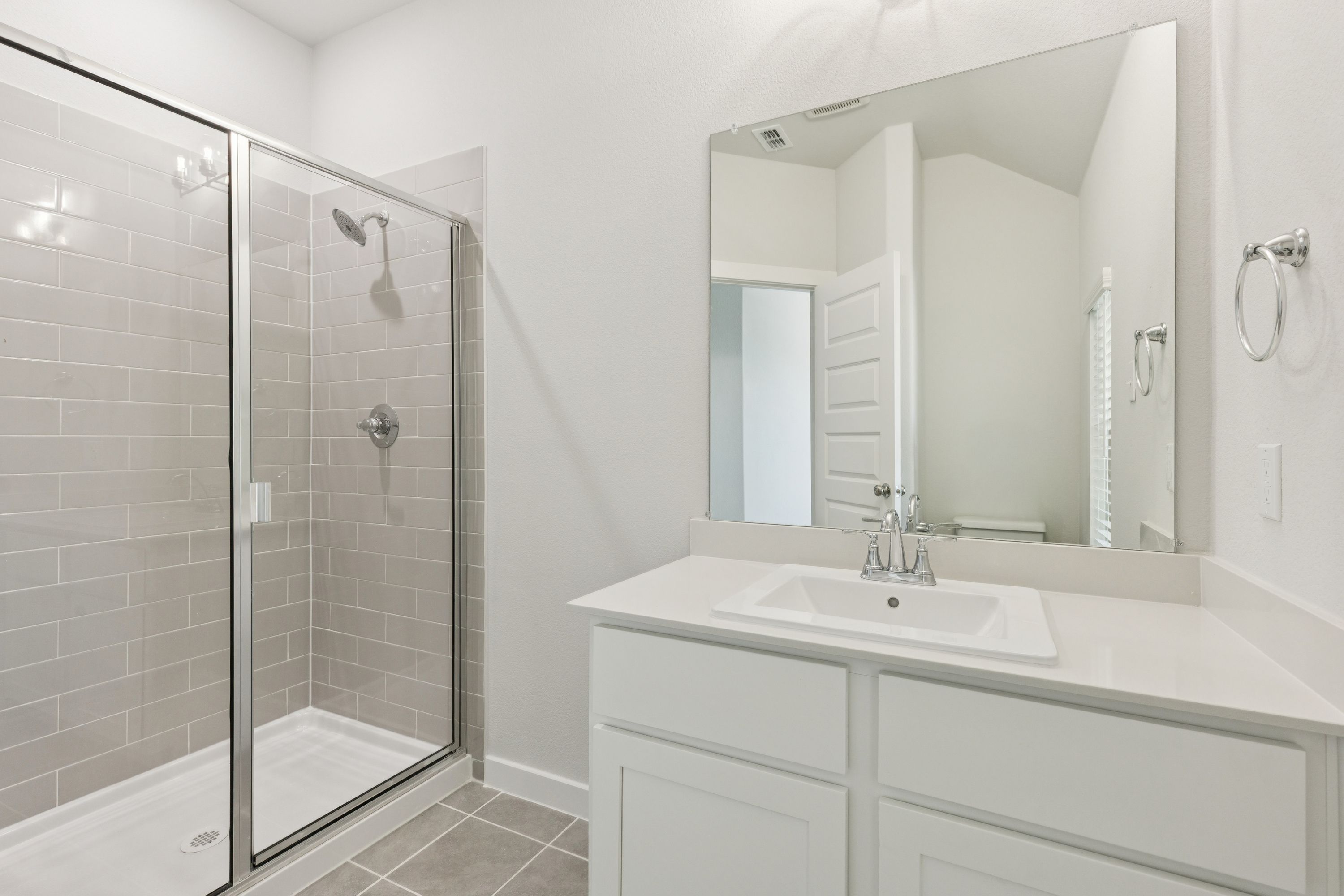 Primary Bathroom in the Masters home plan by Trophy Signature Homes – REPRESENTATIVE PHOTO