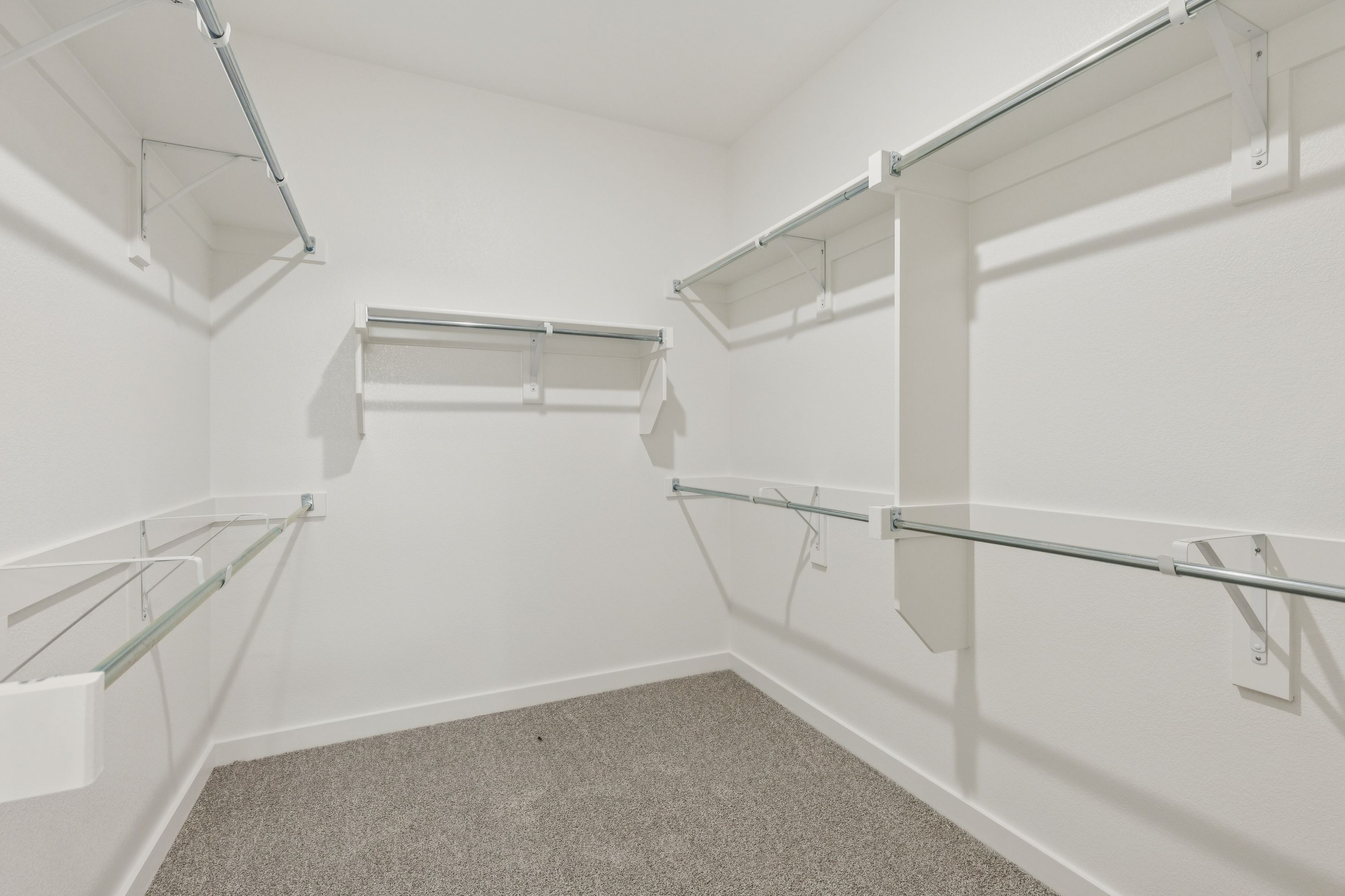 Primary Closet in the Masters home plan by Trophy Signature Homes – REPRESENTATIVE PHOTO