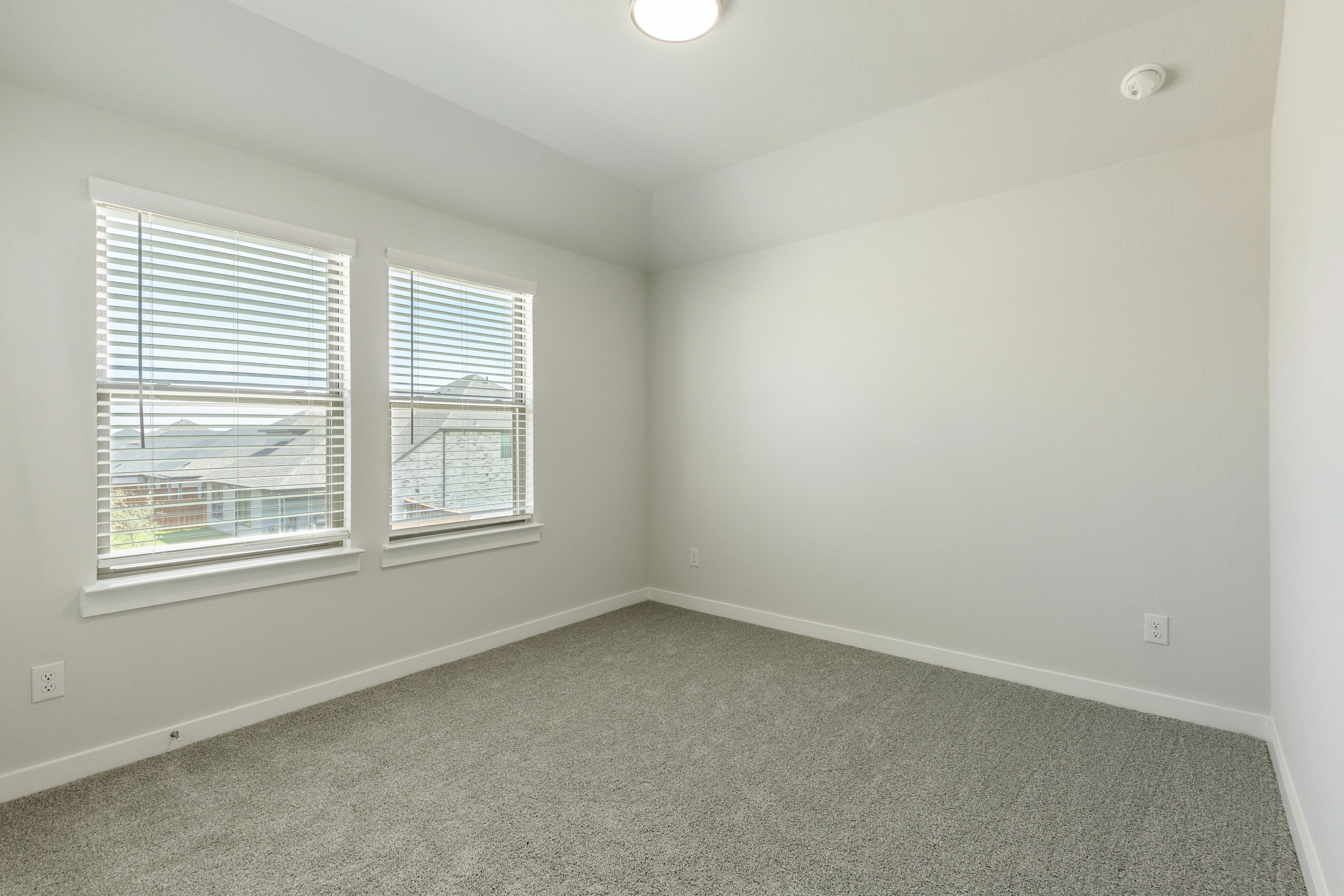 Bedroom in the Masters home plan by Trophy Signature Homes – REPRESENTATIVE PHOTO