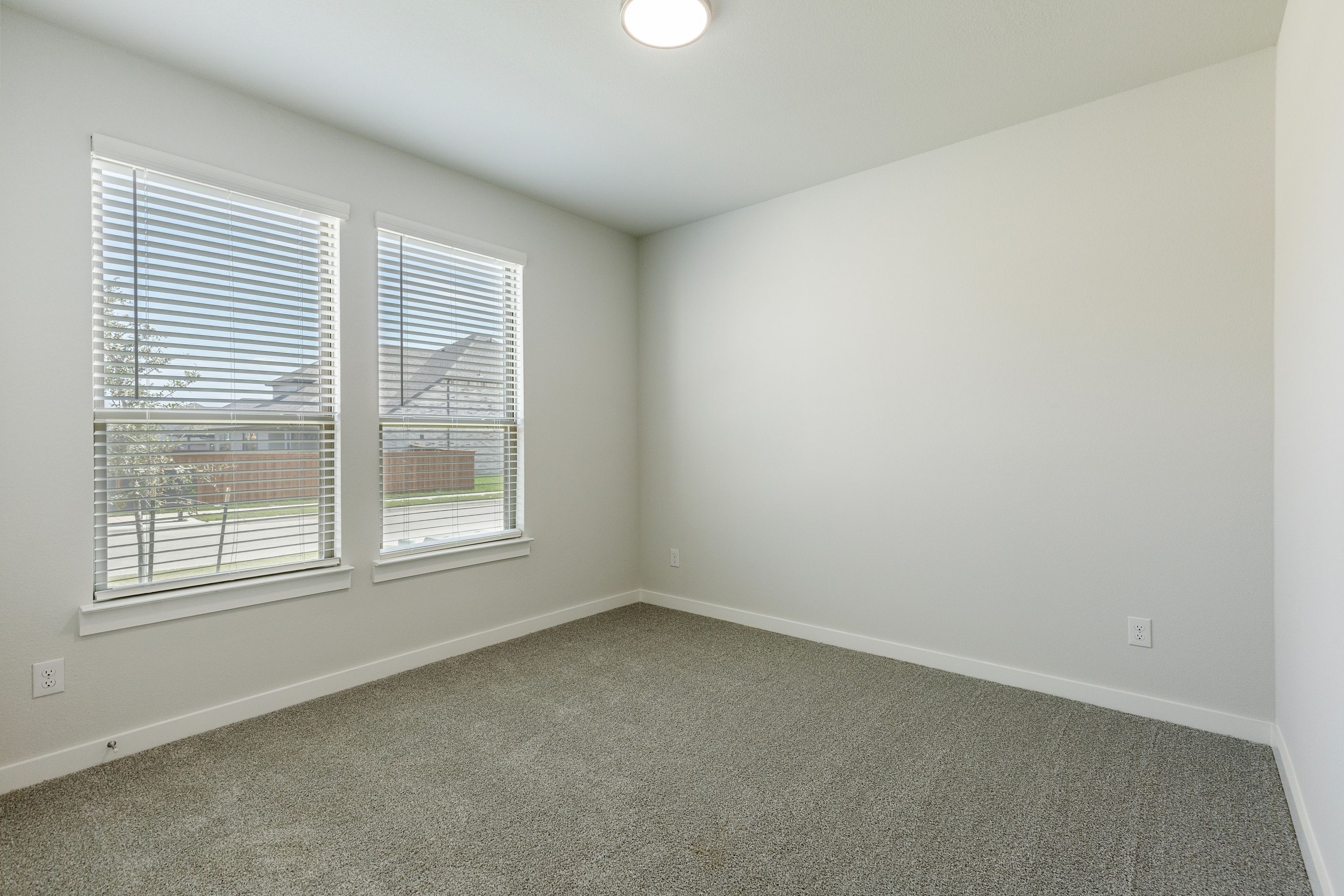 Bedroom in the Masters home plan by Trophy Signature Homes – REPRESENTATIVE PHOTO
