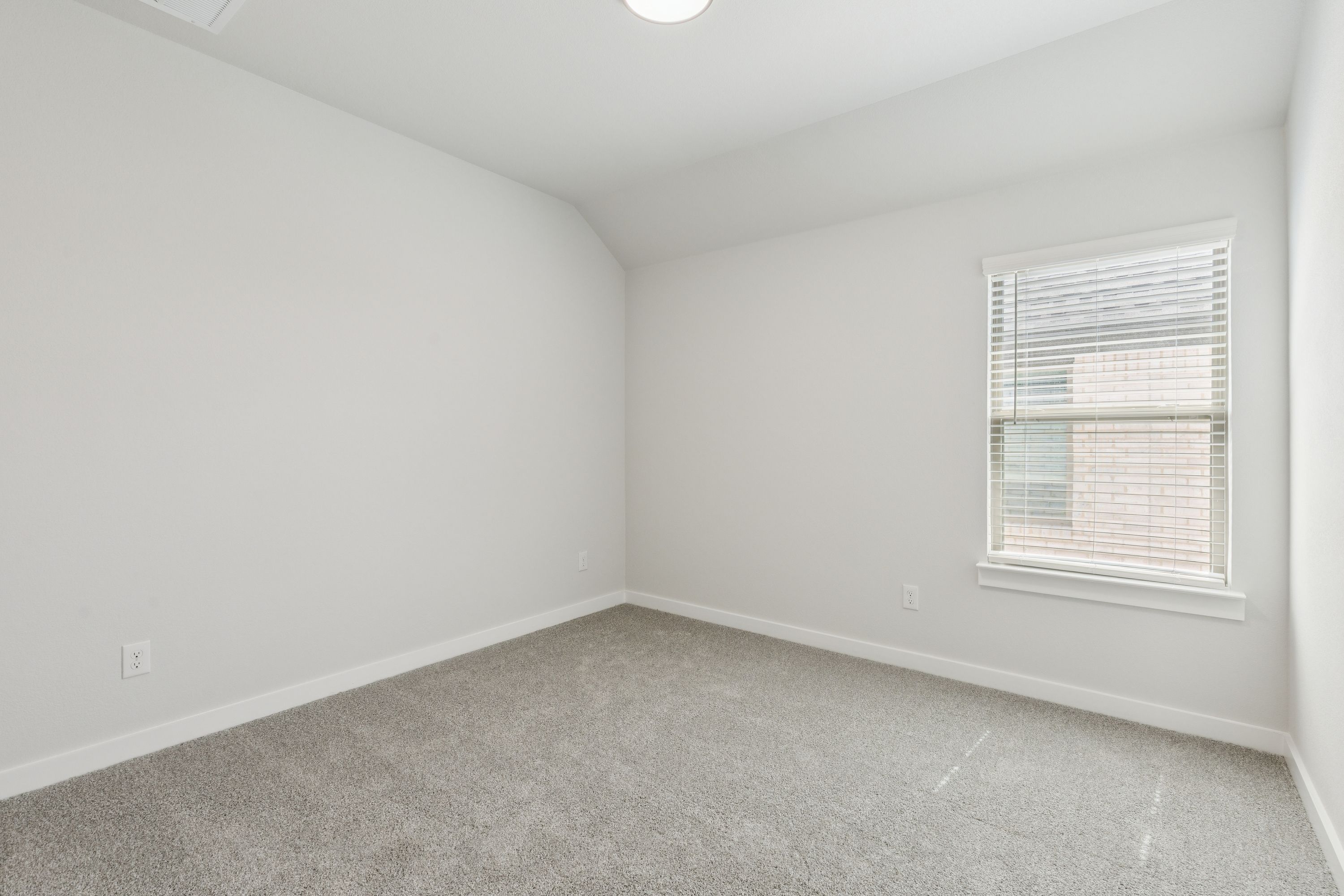 Bedroom in the Masters home plan by Trophy Signature Homes – REPRESENTATIVE PHOTO