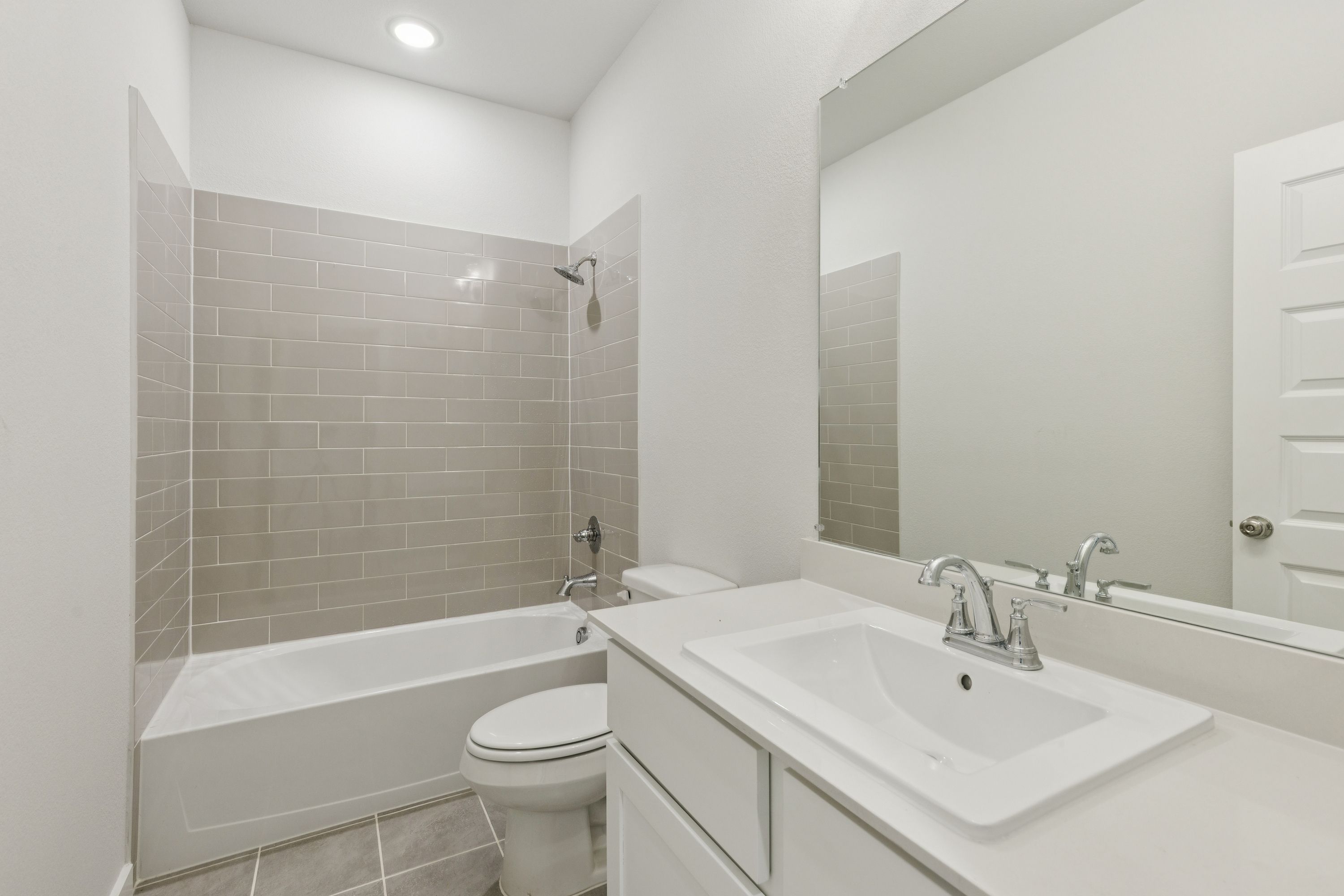 Bathroom in the Masters home plan by Trophy Signature Homes – REPRESENTATIVE PHOTO