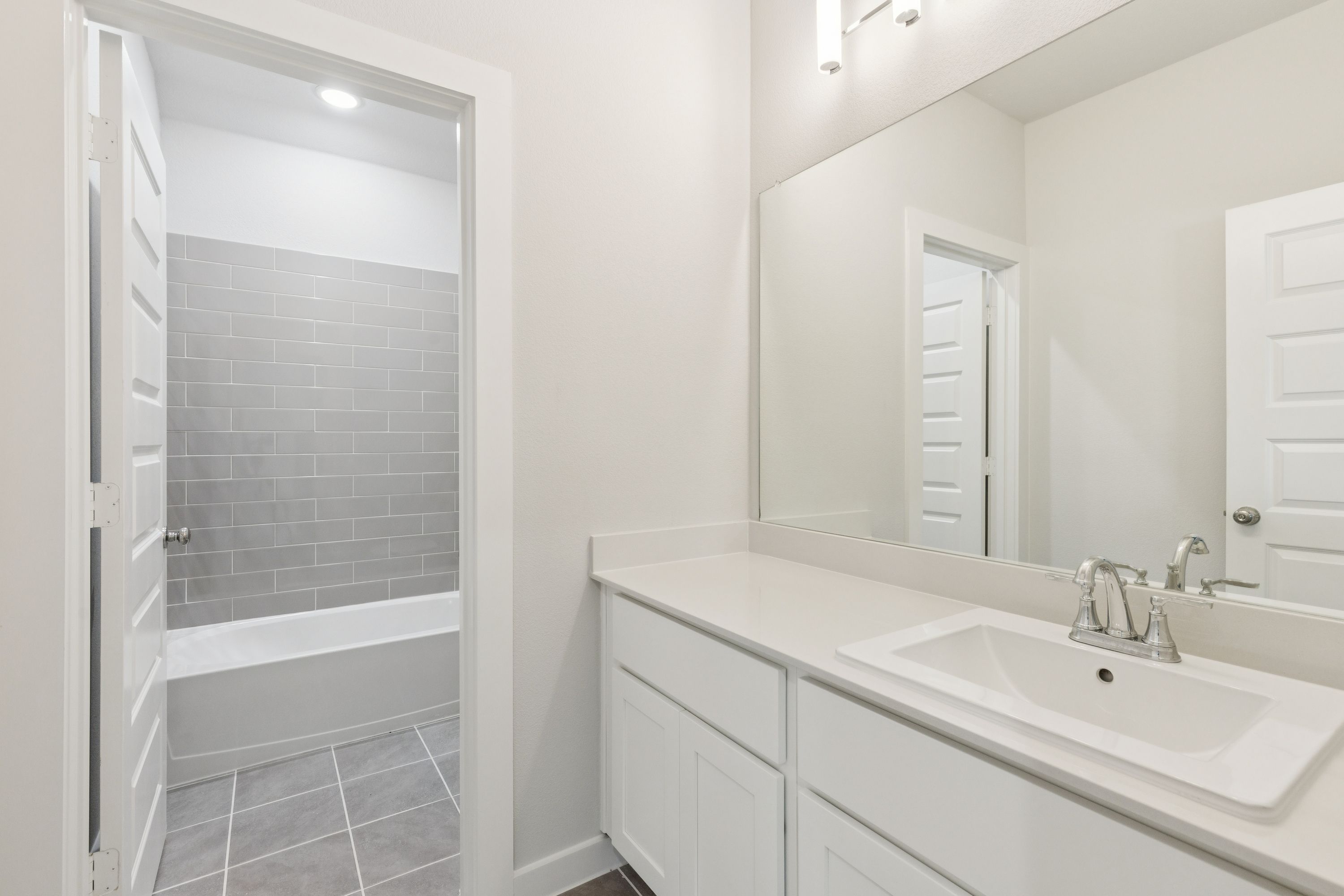 Bathroom in the Masters home plan by Trophy Signature Homes – REPRESENTATIVE PHOTO
