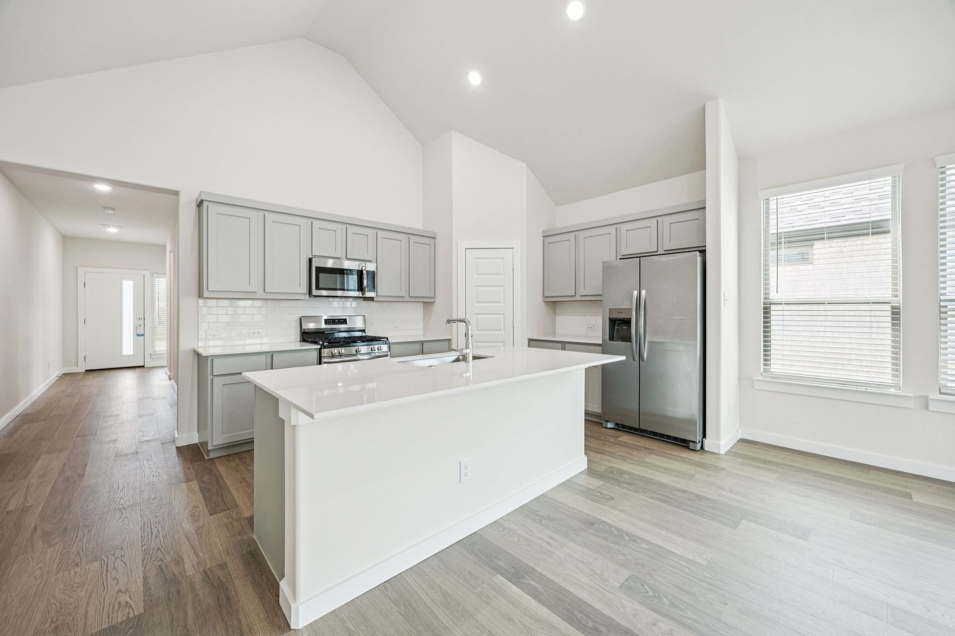 Kitchen in the Claret home plan by Trophy Signature Homes – REPRESENTATIVE PHOTO