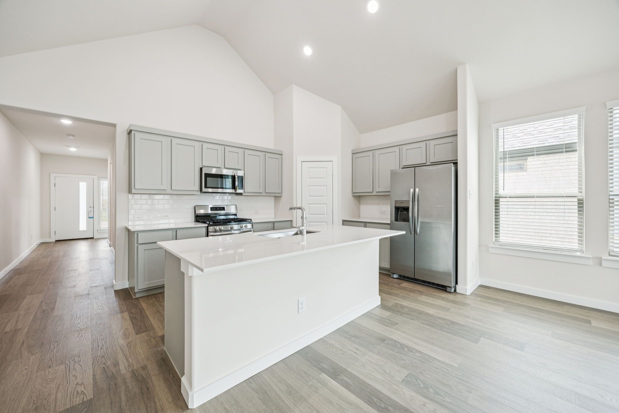 Kitchen in the Claret home plan by Trophy Signature Homes – REPRESENTATIVE PHOTO