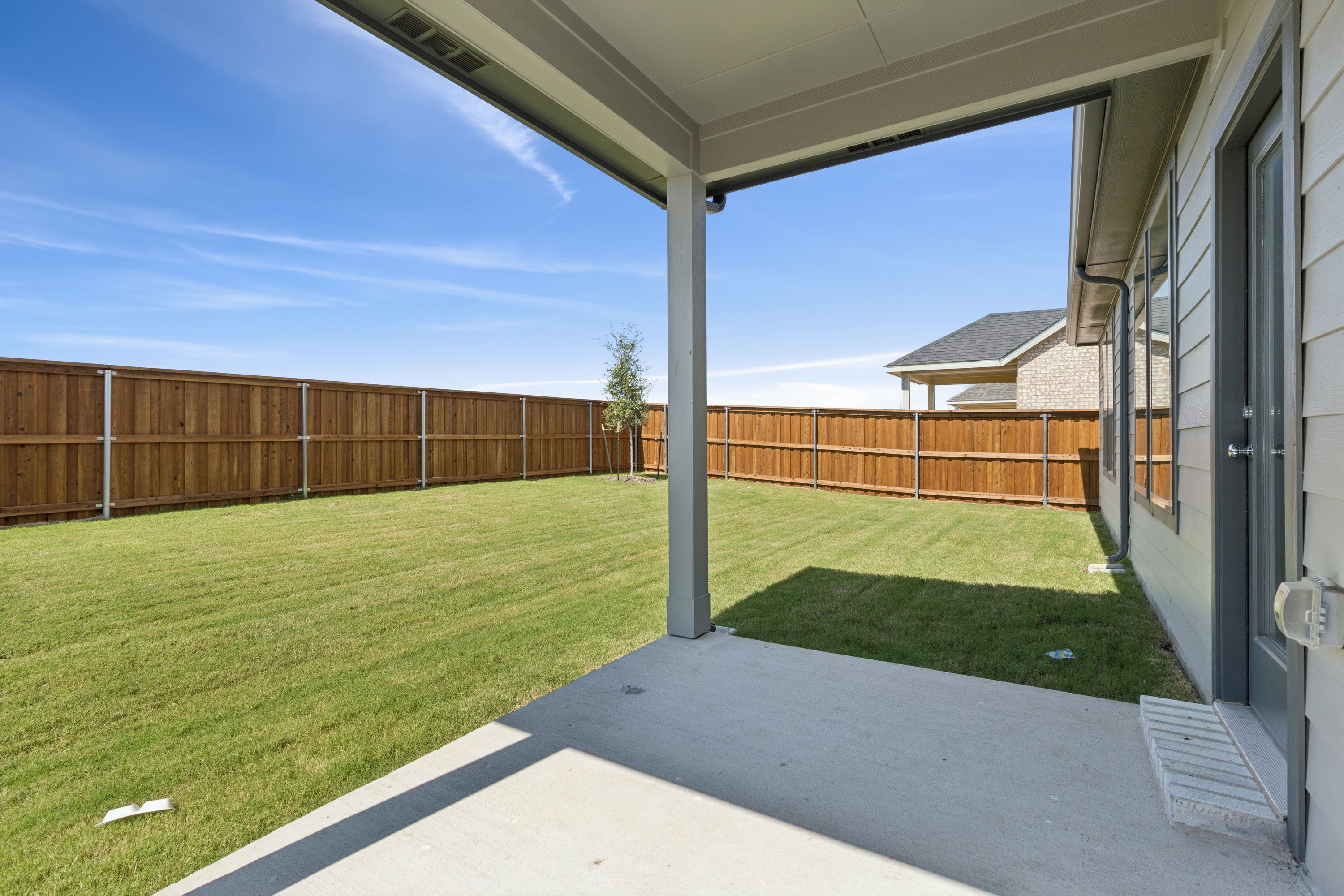 Covered Patio in the Masters home plan by Trophy Signature Homes – REPRESENTATIVE PHOTO