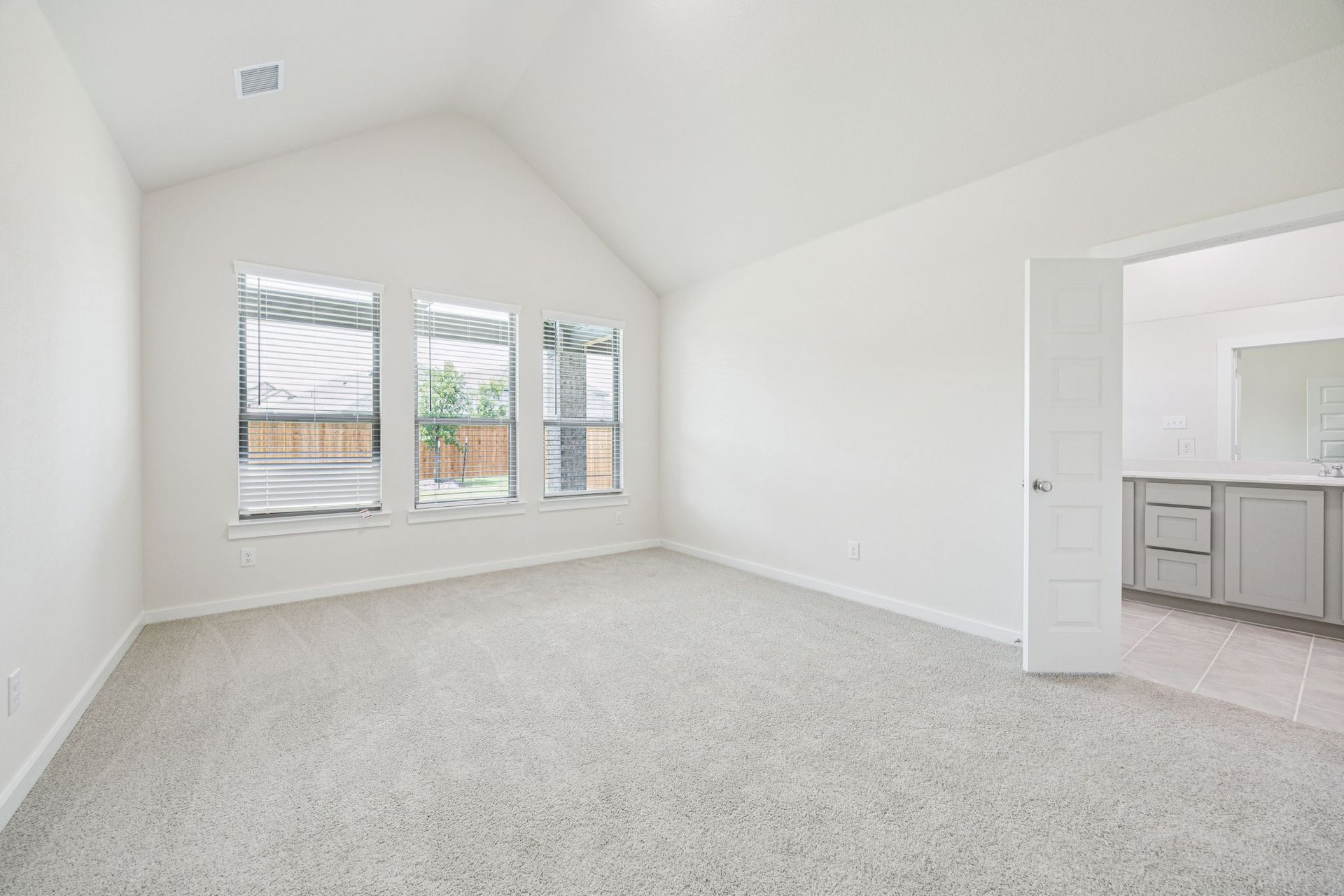 Primary Suite in the Claret home plan by Trophy Signature Homes – REPRESENTATIVE PHOTO