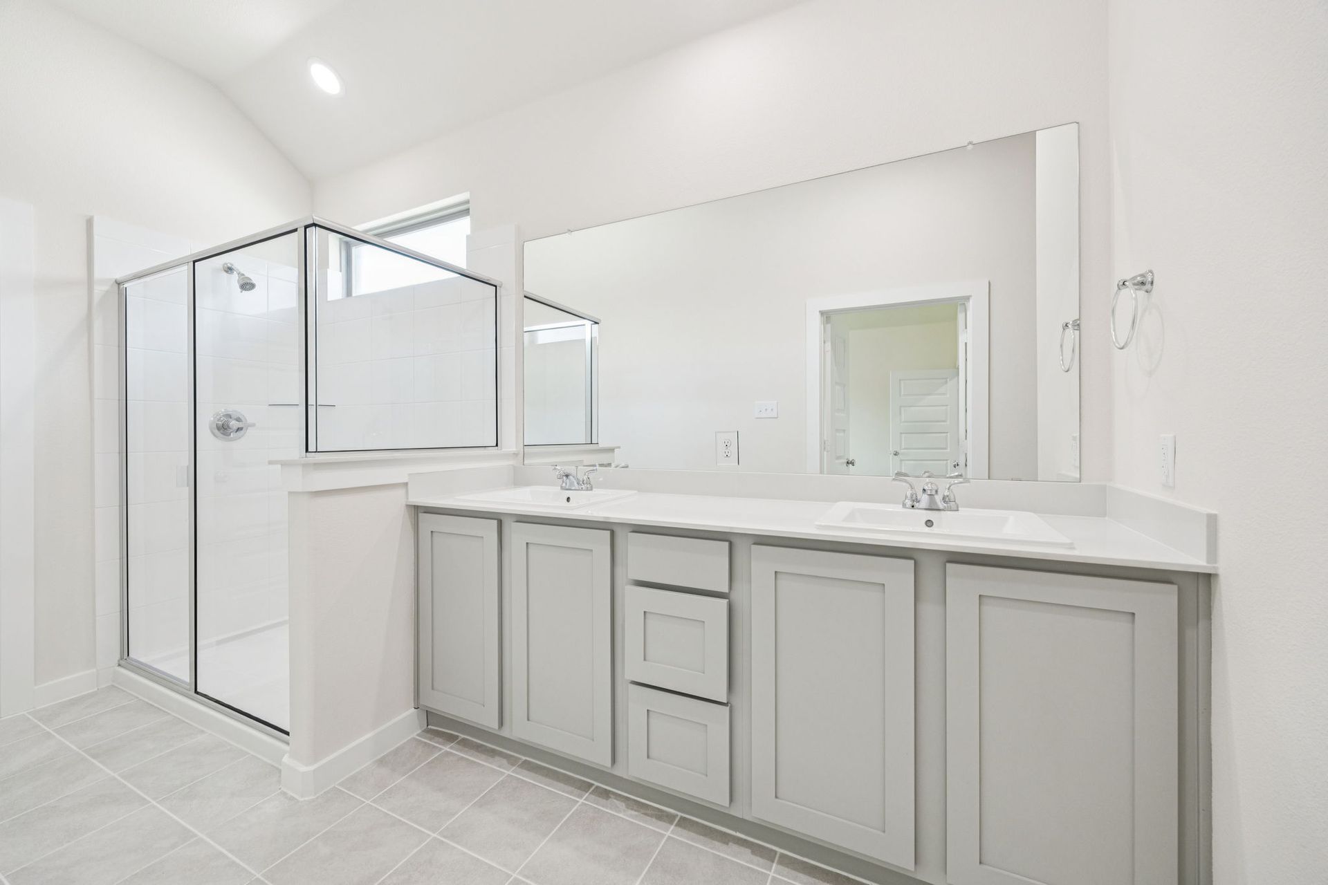 Primary Bathroom in the Claret home plan by Trophy Signature Homes – REPRESENTATIVE PHOTO