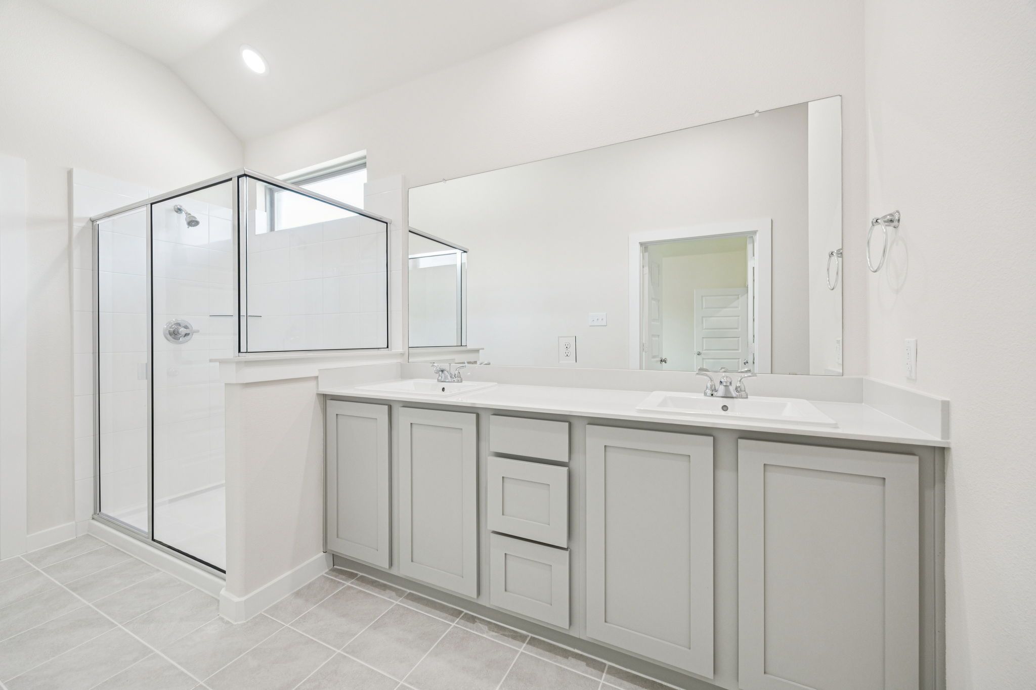 Primary Bathroom in the Claret home plan by Trophy Signature Homes – REPRESENTATIVE PHOTO