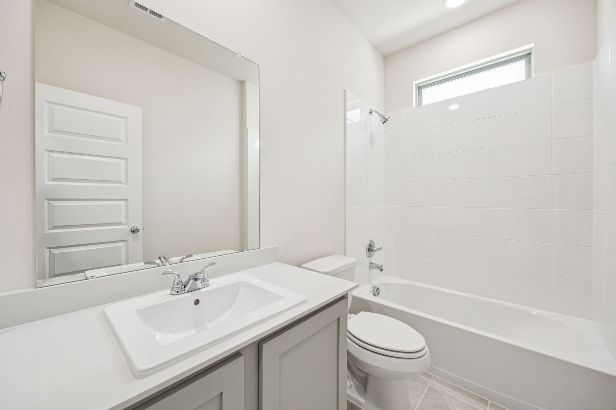 Bathroom in the Claret home plan by Trophy Signature Homes – REPRESENTATIVE PHOTO