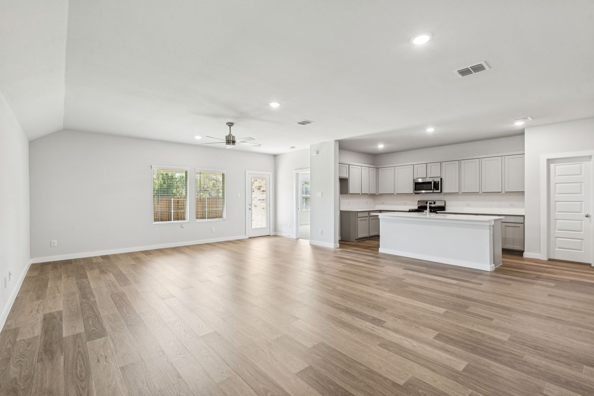 Open Floor Plan in the Oscar home plan by Trophy Signature Homes – REPRESENTATIVE PHOTO