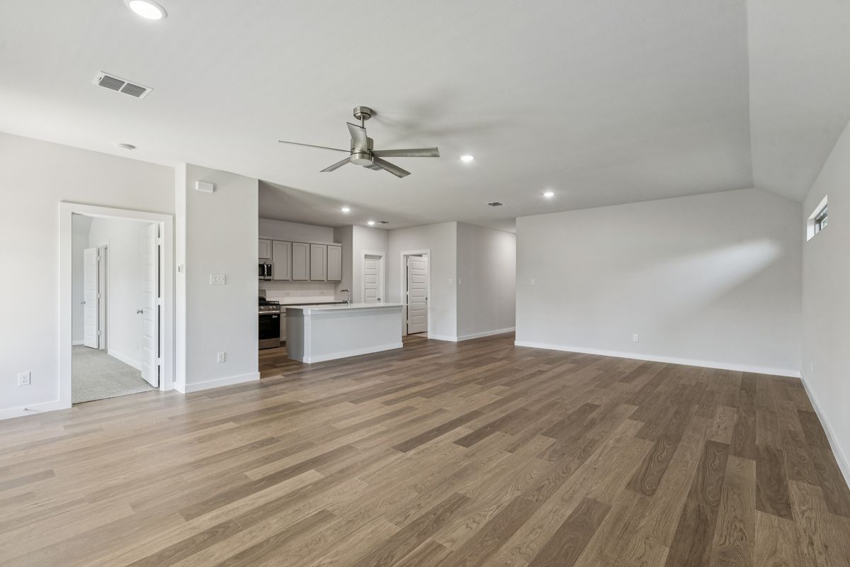 Open Floor Plan in the Oscar home plan by Trophy Signature Homes – REPRESENTATIVE PHOTO