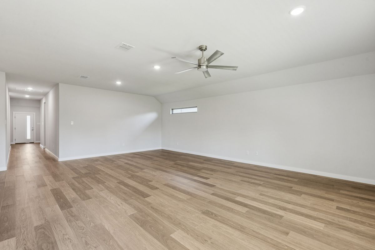 Living and Dining Rooms in the Oscar home plan by Trophy Signature Homes – REPRESENTATIVE PHOTO
