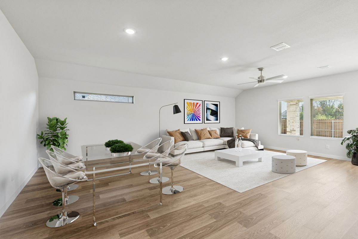 Living and Dining Rooms in the Oscar home plan by Trophy Signature Homes – REPRESENTATIVE PHOTO