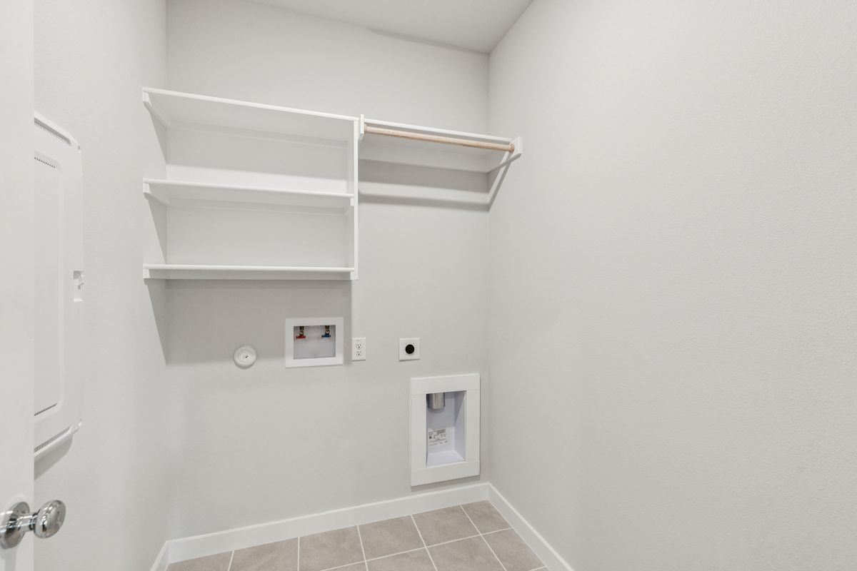 Utility Room in the Oscar home plan by Trophy Signature Homes – REPRESENTATIVE PHOTO