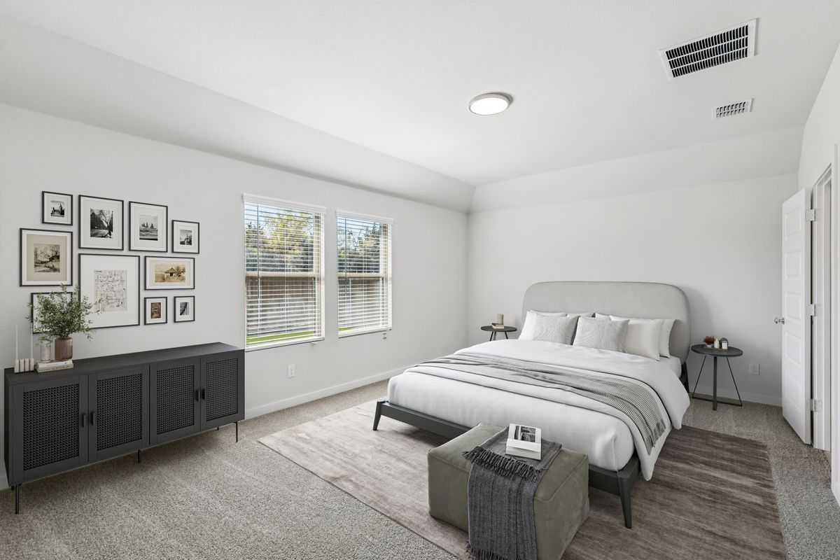 Primary Suite in the Oscar home plan by Trophy Signature Homes – REPRESENTATIVE PHOTO