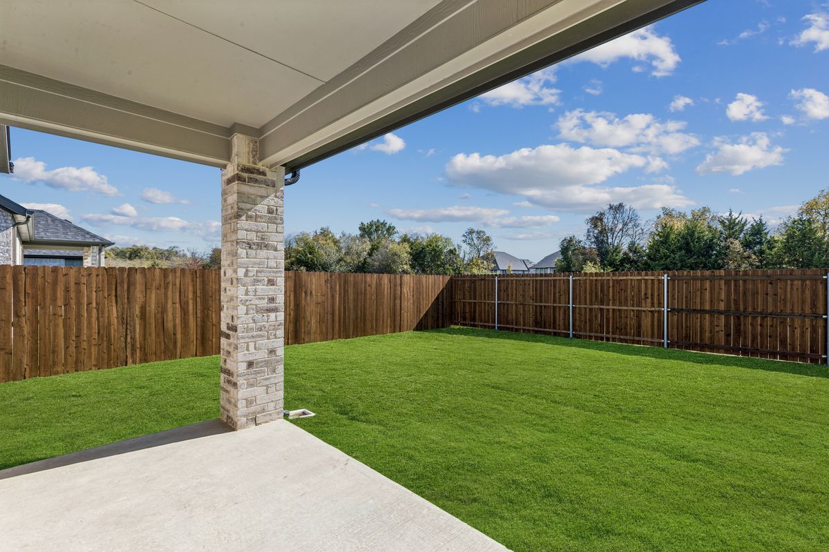 Covered Patio in the Oscar home plan by Trophy Signature Homes – REPRESENTATIVE PHOTO