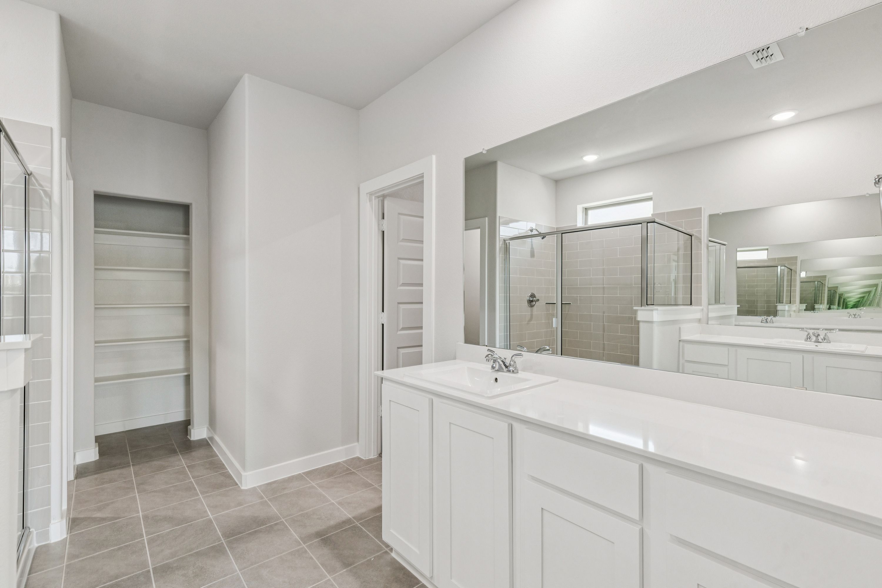 Primary Bathroom in the Winters home plan by Trophy Signature Homes – REPRESENTATIVE PHOTO