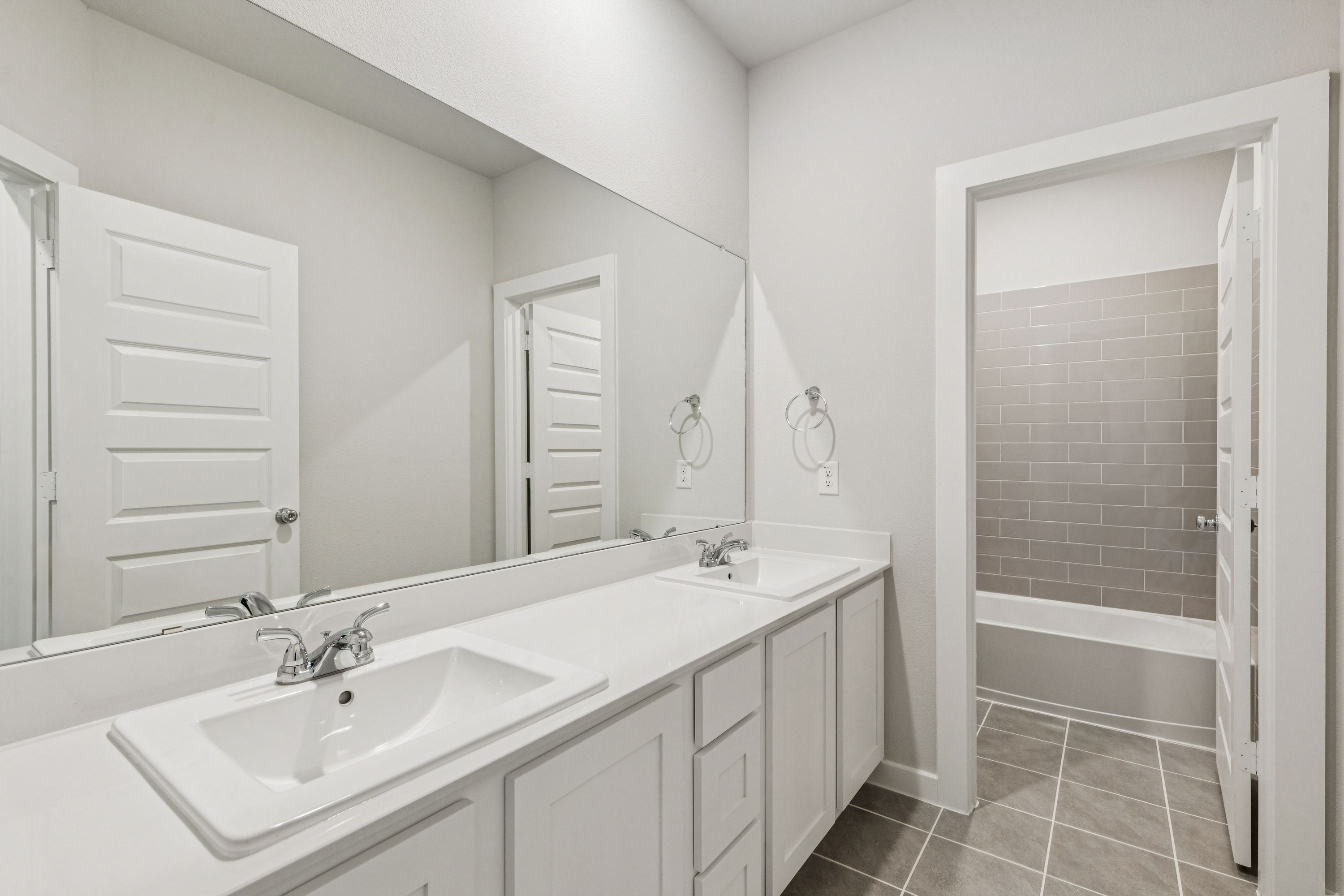 Bathroom in the Winters home plan by Trophy Signature Homes – REPRESENTATIVE PHOTO