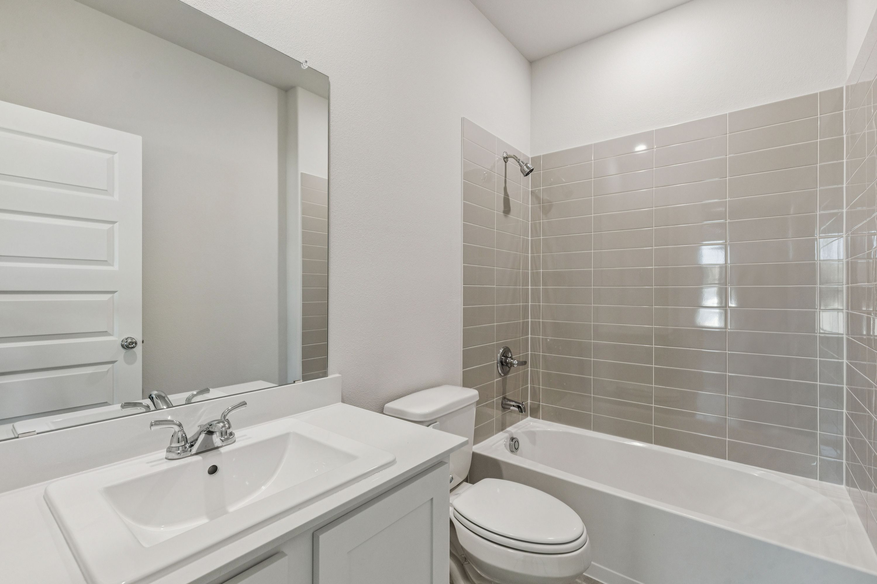 Bathroom in the Winters home plan by Trophy Signature Homes – REPRESENTATIVE PHOTO