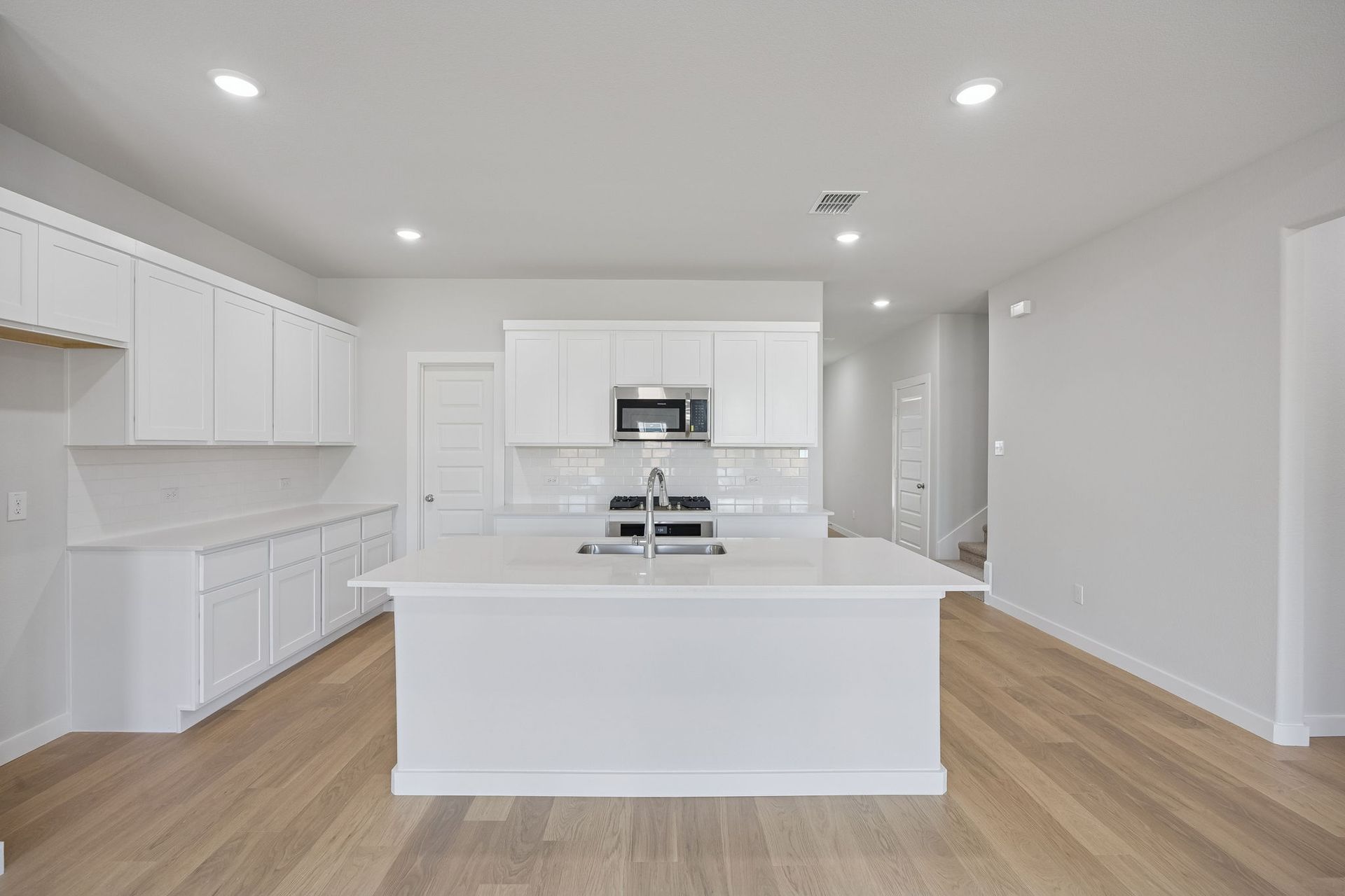 Kitchen in the Masters home plan by Trophy Signature Homes – REPRESENTATIVE PHOTO