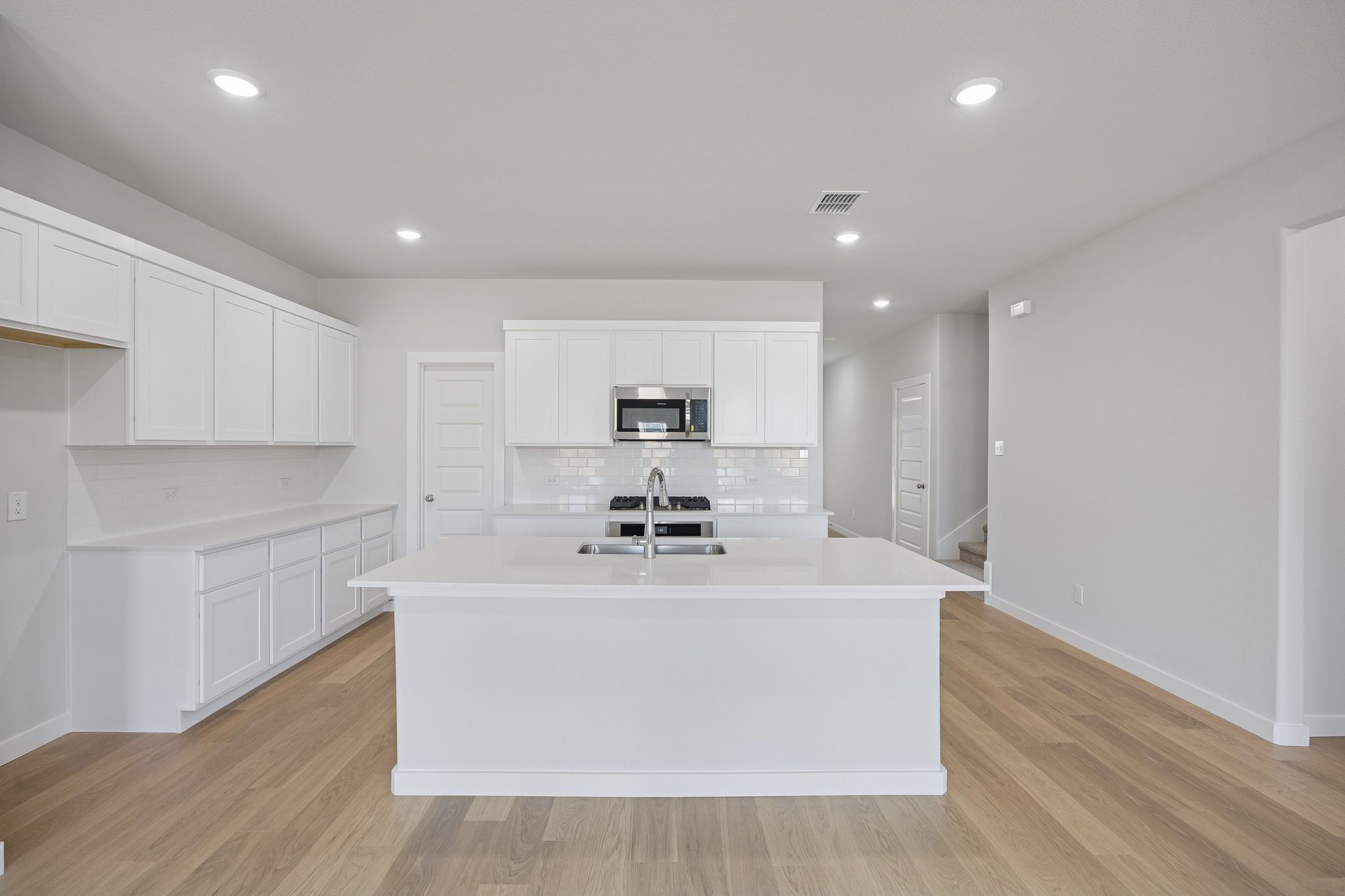 Kitchen in the Masters home plan by Trophy Signature Homes – REPRESENTATIVE PHOTO
