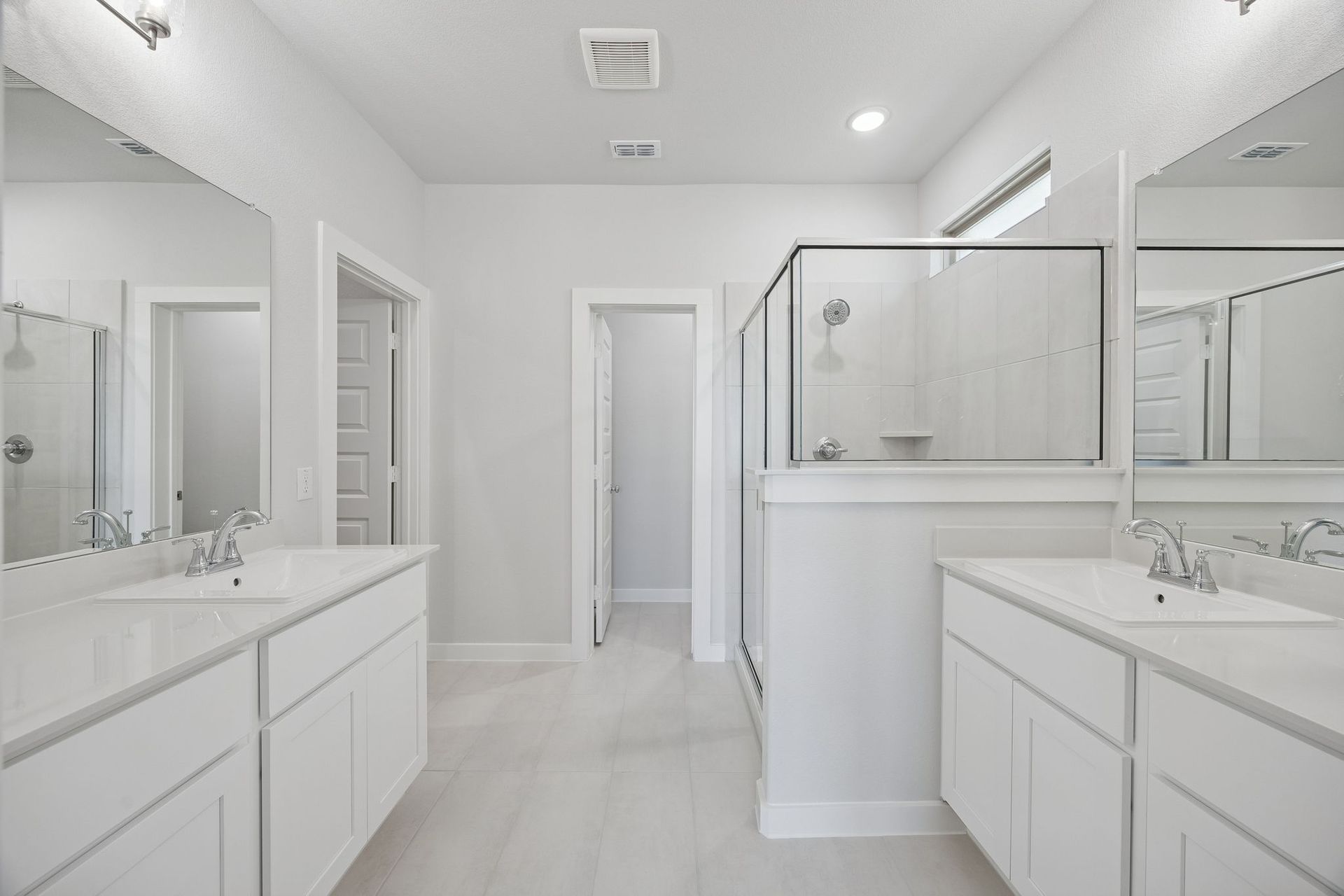 Primary Bathroom in the Masters home plan by Trophy Signature Homes – REPRESENTATIVE PHOTO