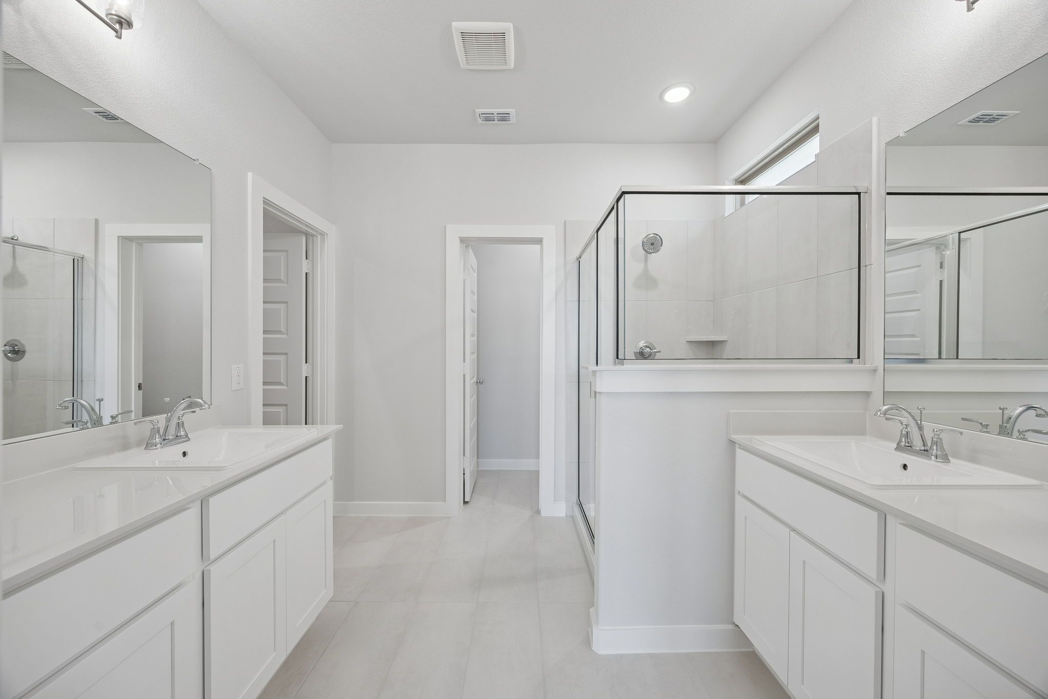 Primary Bathroom in the Masters home plan by Trophy Signature Homes – REPRESENTATIVE PHOTO