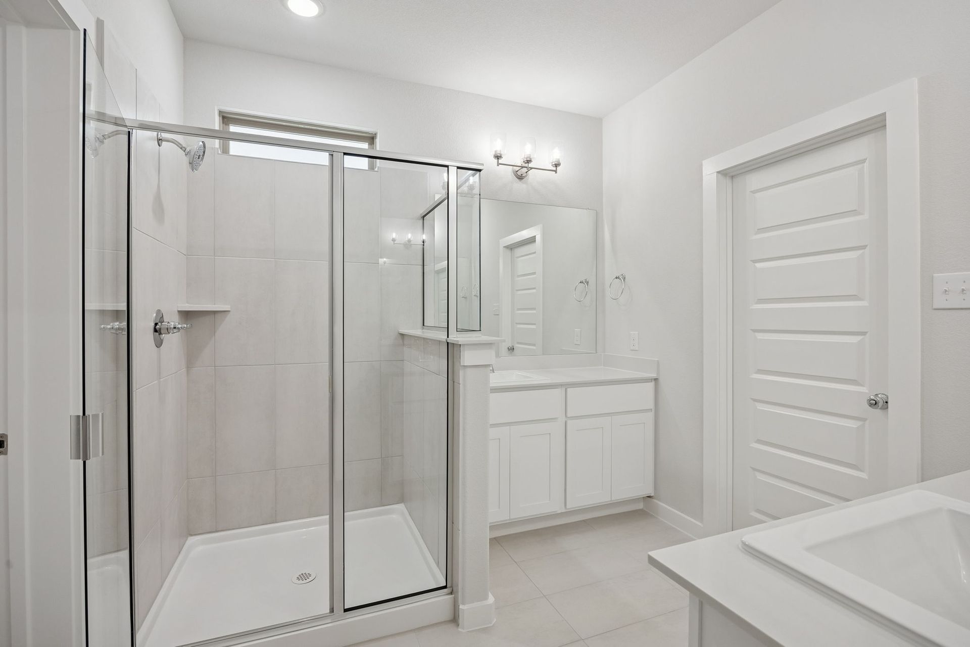 Primary Bathroom in the Masters home plan by Trophy Signature Homes – REPRESENTATIVE PHOTO