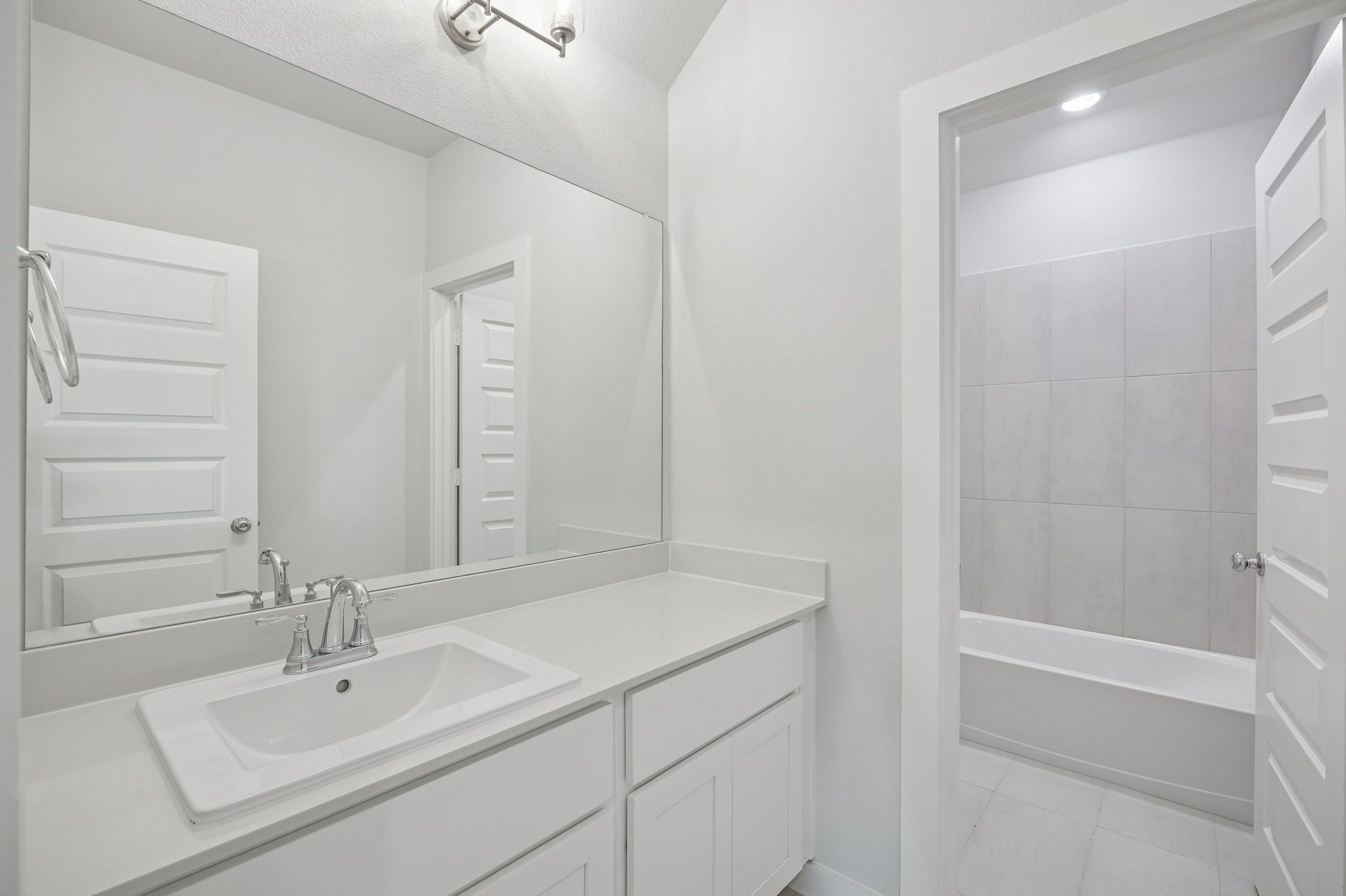 Bathroom in the Masters home plan by Trophy Signature Homes – REPRESENTATIVE PHOTO