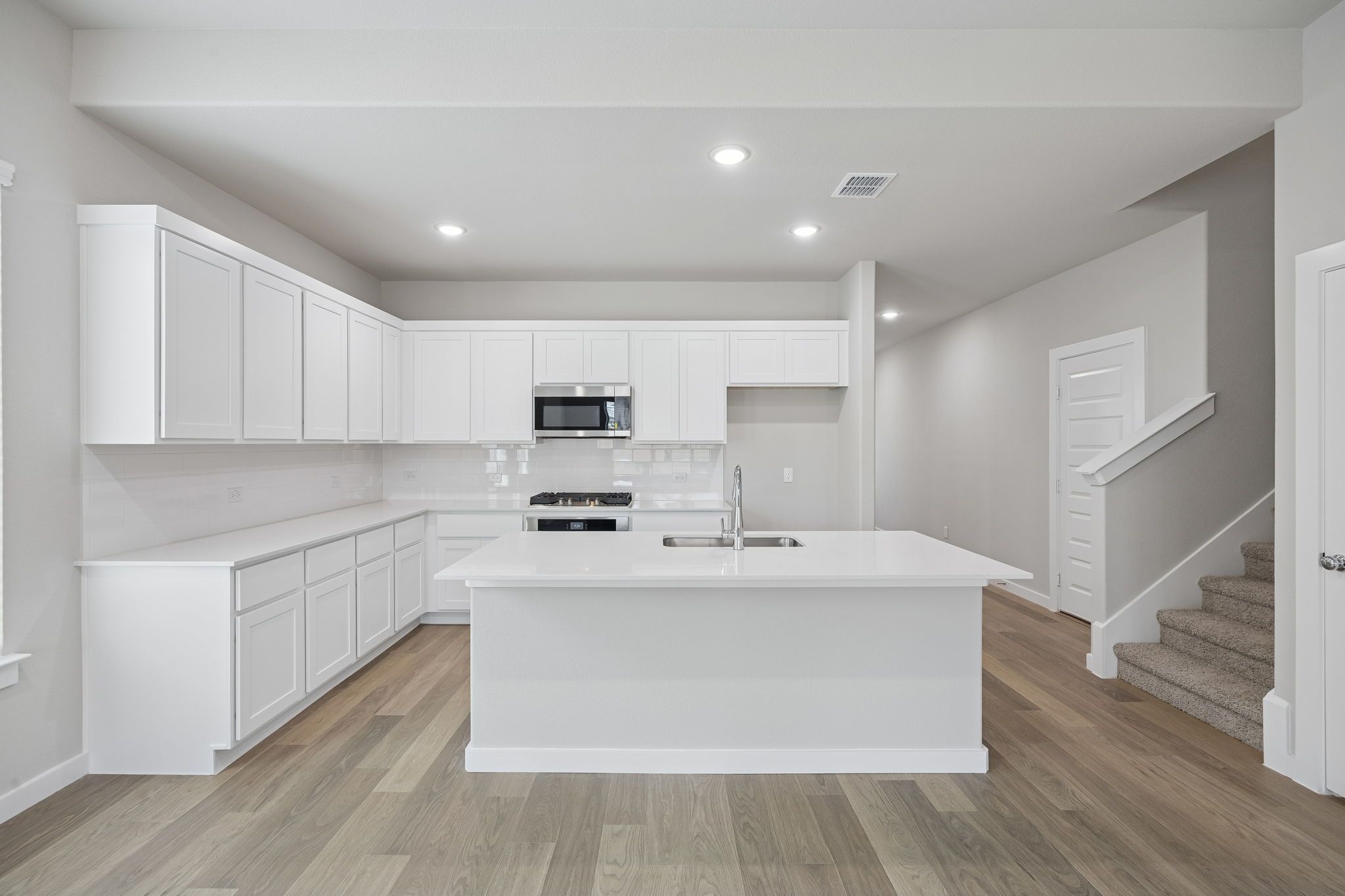 Kitchen in the Stanley II home plan by Trophy Signature Homes – REPRESENTATIVE PHOTO