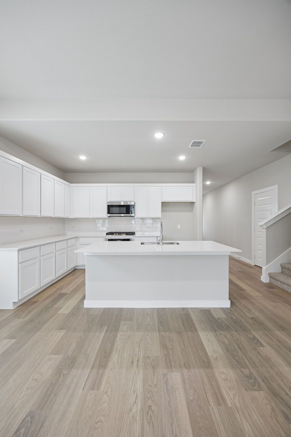 Kitchen in the Stanley II home plan by Trophy Signature Homes – REPRESENTATIVE PHOTO