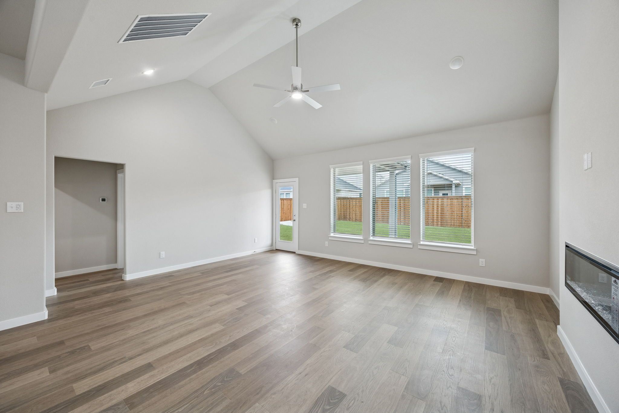 Living and Dining Room in the Stanley II home plan by Trophy Signature Homes – REPRESENTATIVE PHO