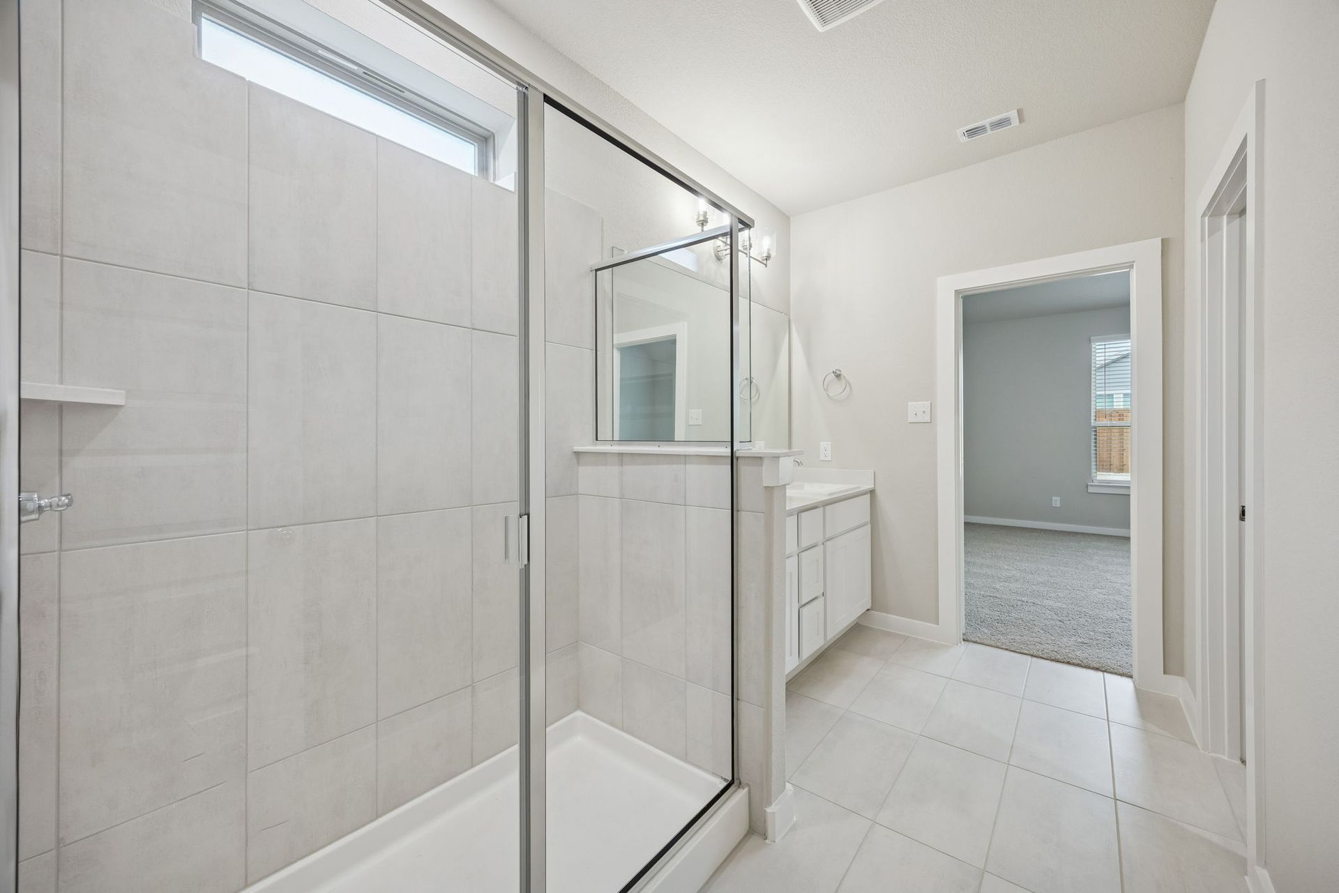 Primary Bathroom in the Stanley II home plan by Trophy Signature Homes – REPRESENTATIVE PHOTO