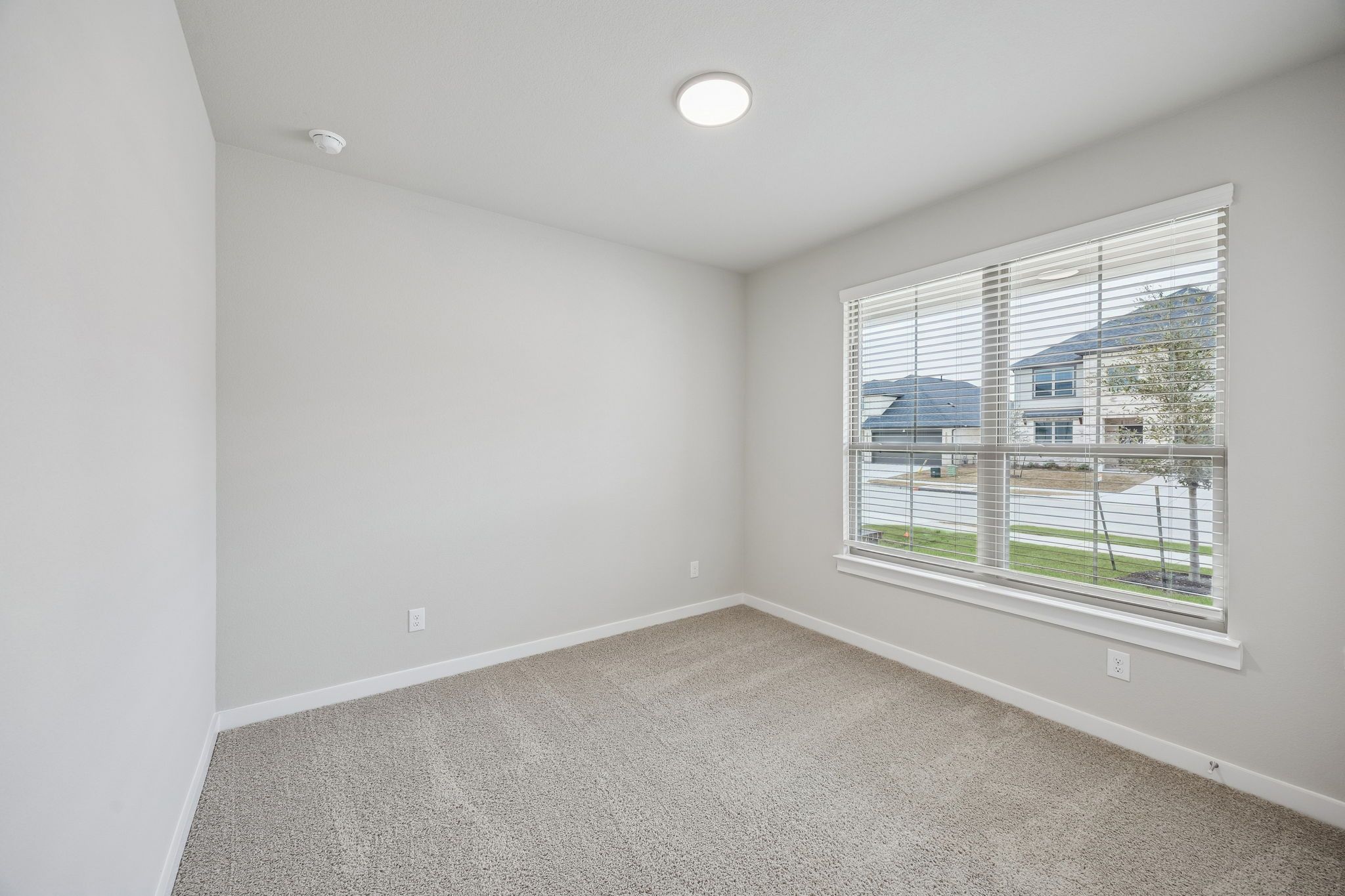 Bedroom in the Stanley II home plan by Trophy Signature Homes – REPRESENTATIVE PHOTO