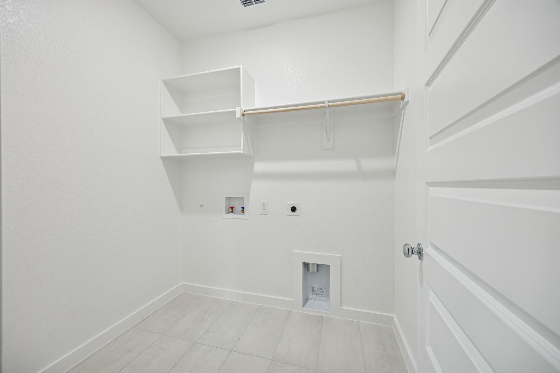 Utility Room in the Stanley II home plan by Trophy Signature Homes – REPRESENTATIVE PHOTO