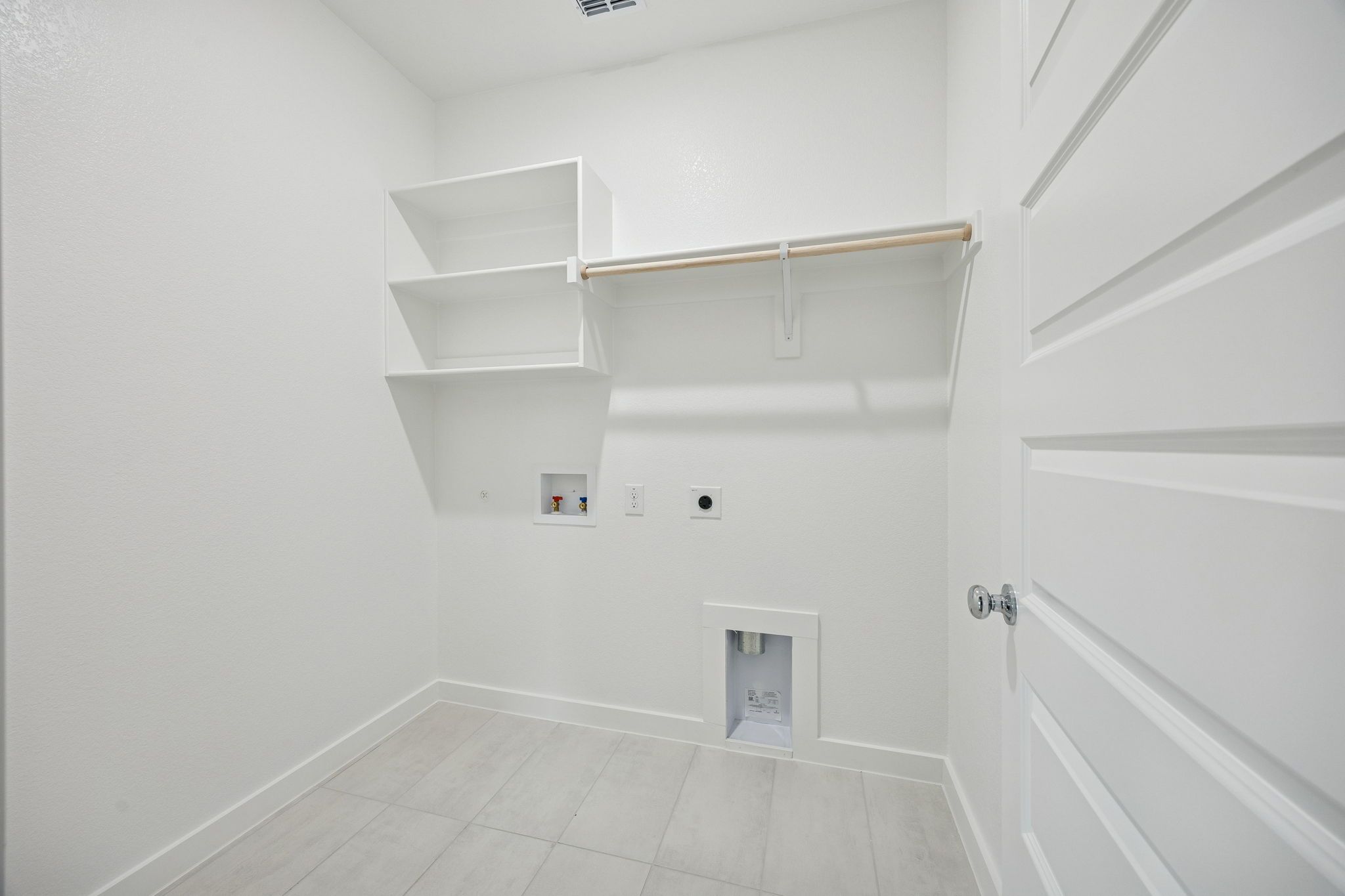 Utility Room in the Stanley II home plan by Trophy Signature Homes – REPRESENTATIVE PHOTO