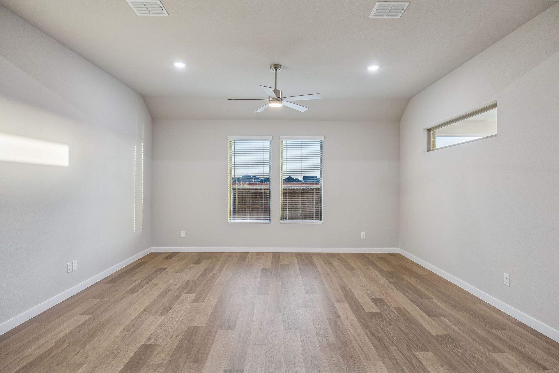 Living Room in the Wimbledon home plan by Trophy Signature Homes – REPRESENTATIVE PHOTO