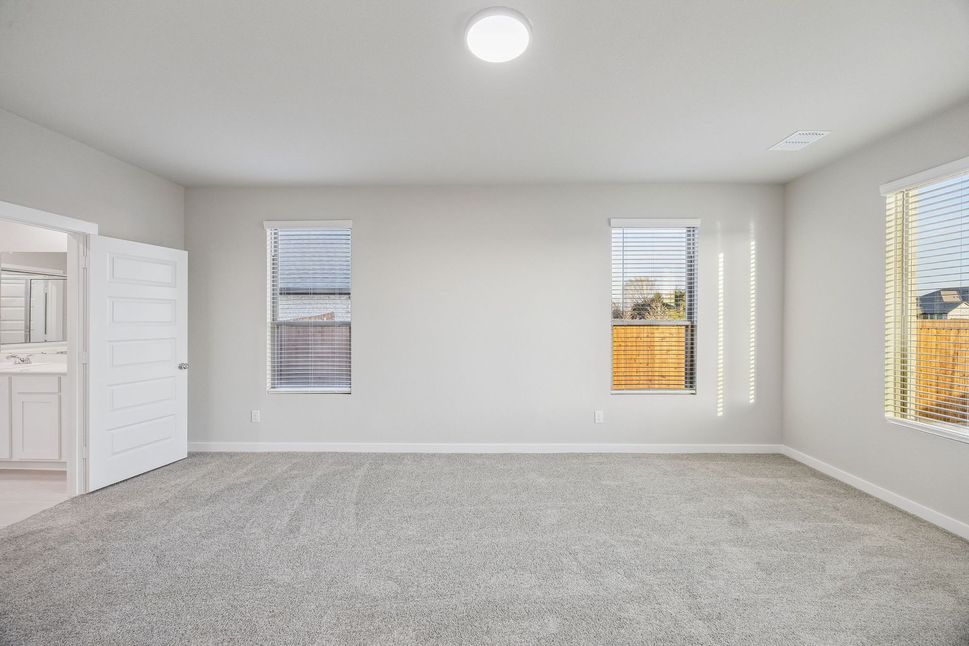 Primary Suite in the Wimbledon home plan by Trophy Signature Homes – REPRESENTATIVE PHOTO