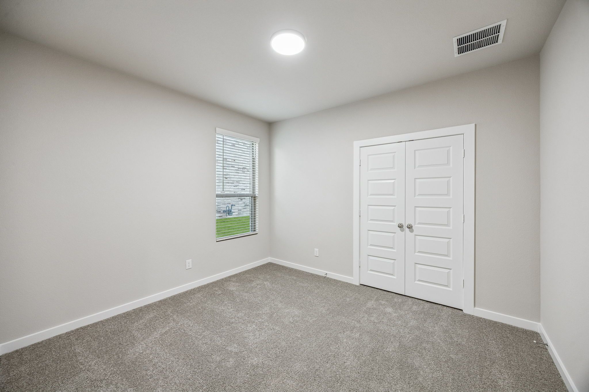 Bedroom in the Wimbledon home plan by Trophy Signature Homes – REPRESENTATIVE PHOTO