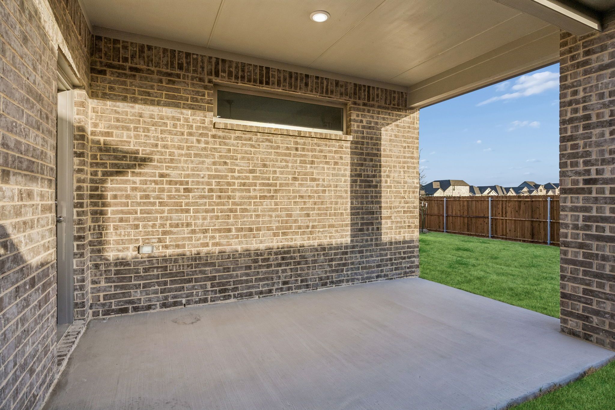 Covered Patio in the Wimbledon home plan by Trophy Signature Homes – REPRESENTATIVE PHOTO