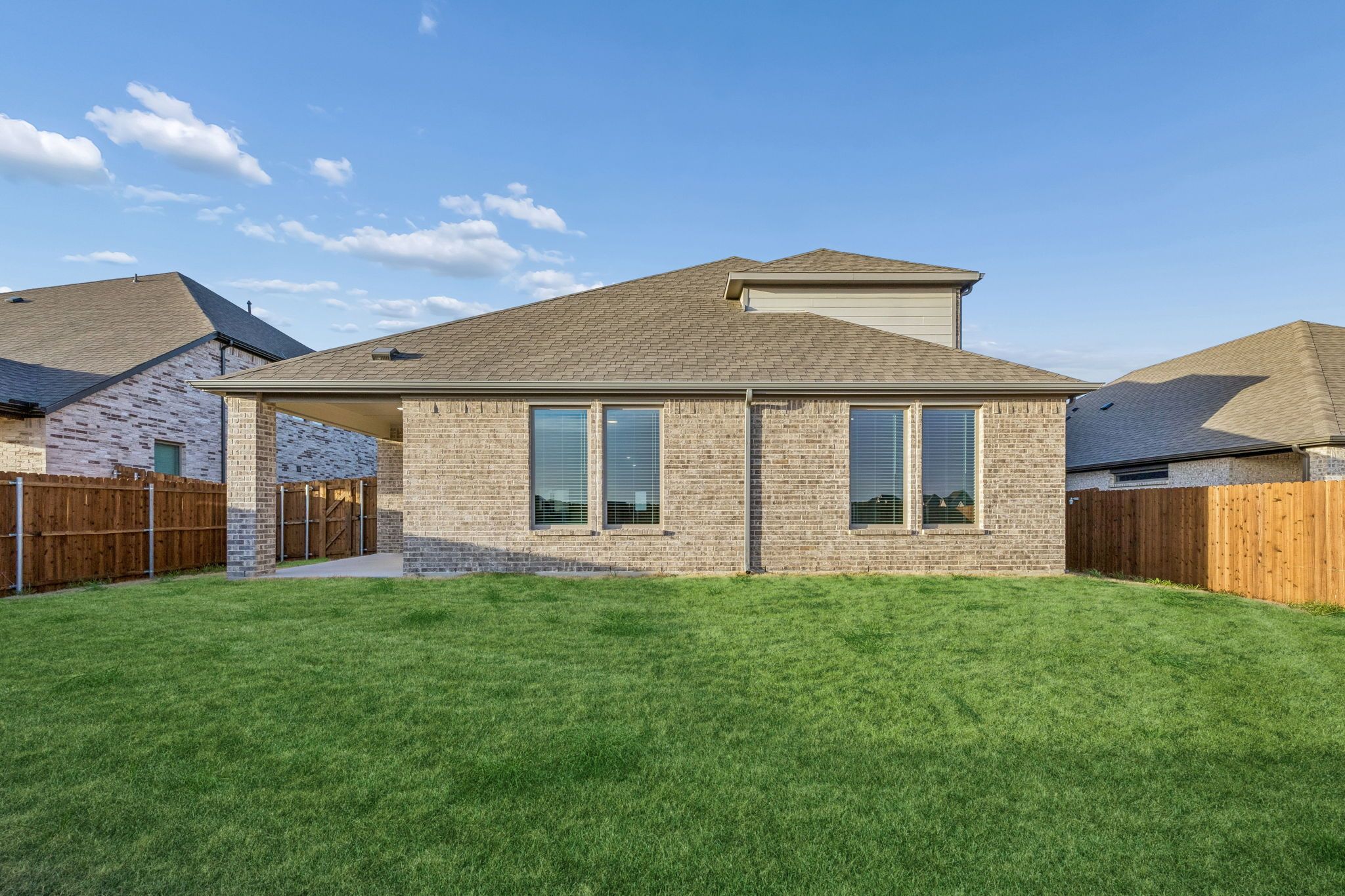 Covered Patio in the Wimbledon home plan by Trophy Signature Homes – REPRESENTATIVE PHOTO