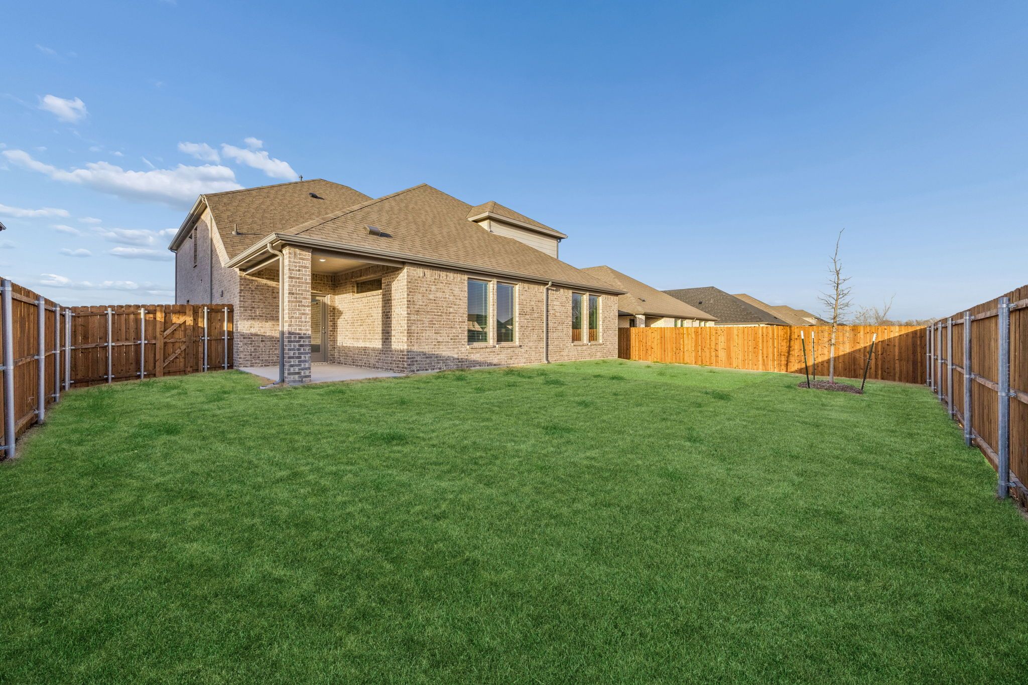 Covered Patio in the Wimbledon home plan by Trophy Signature Homes – REPRESENTATIVE PHOTO