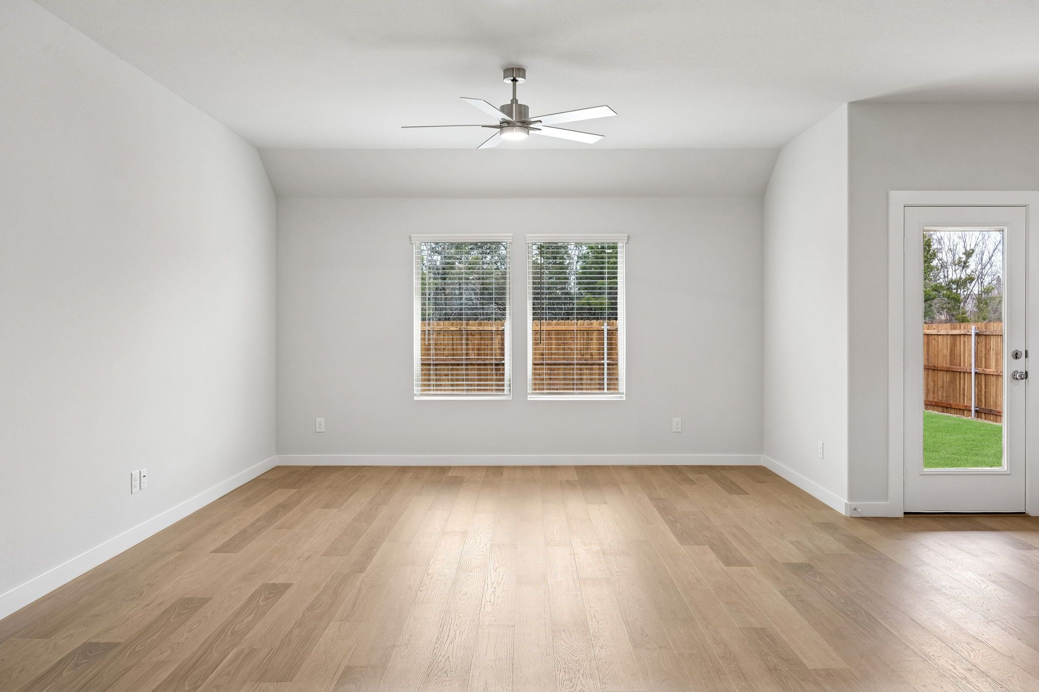 Living Room in the Heisman home plan by Trophy Signature Homes - REPRESENTATIVE PHOTO