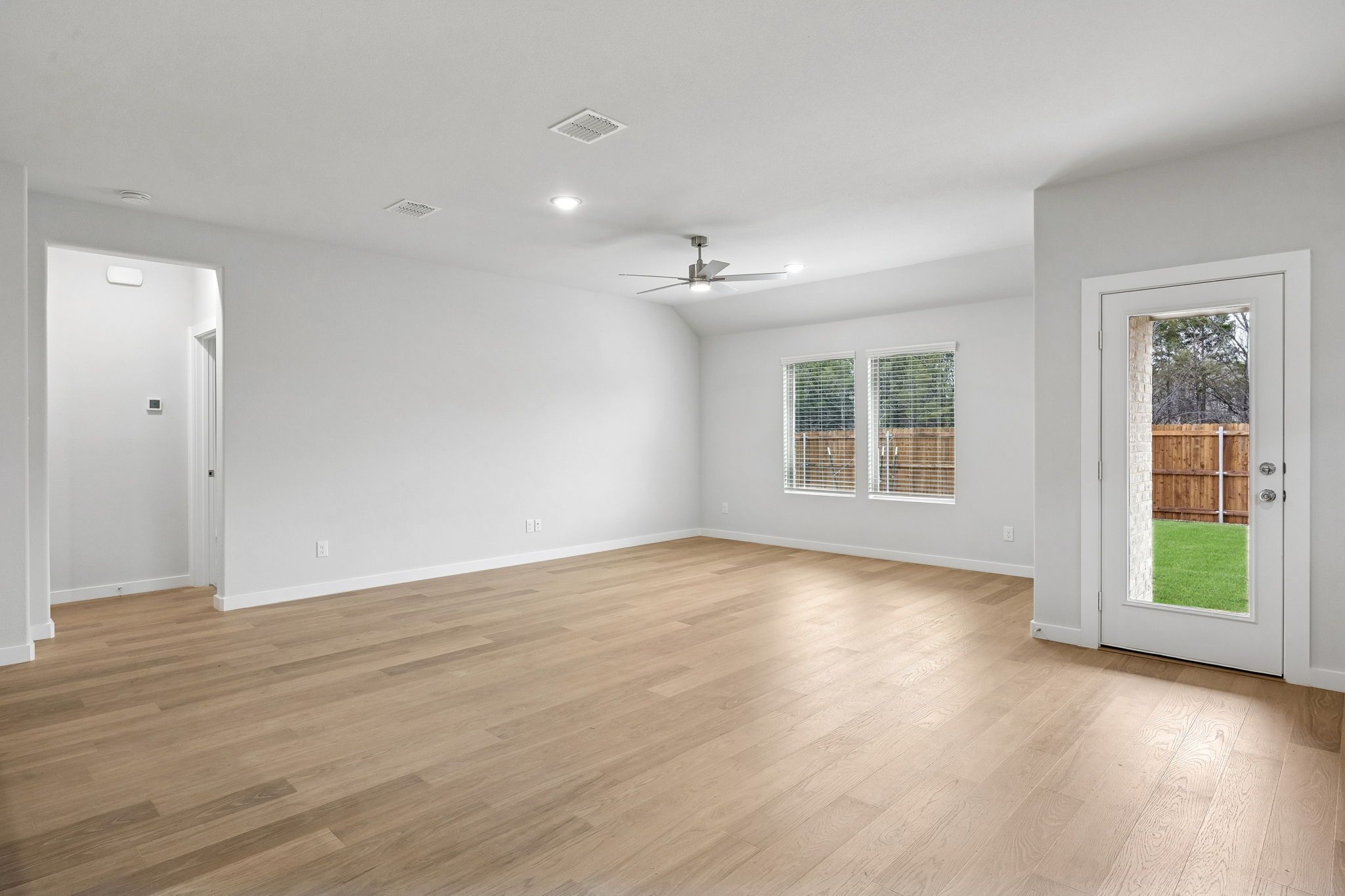 Living Area in the Heisman home plan by Trophy Signature Homes - REPRESENTATIVE PHOTO