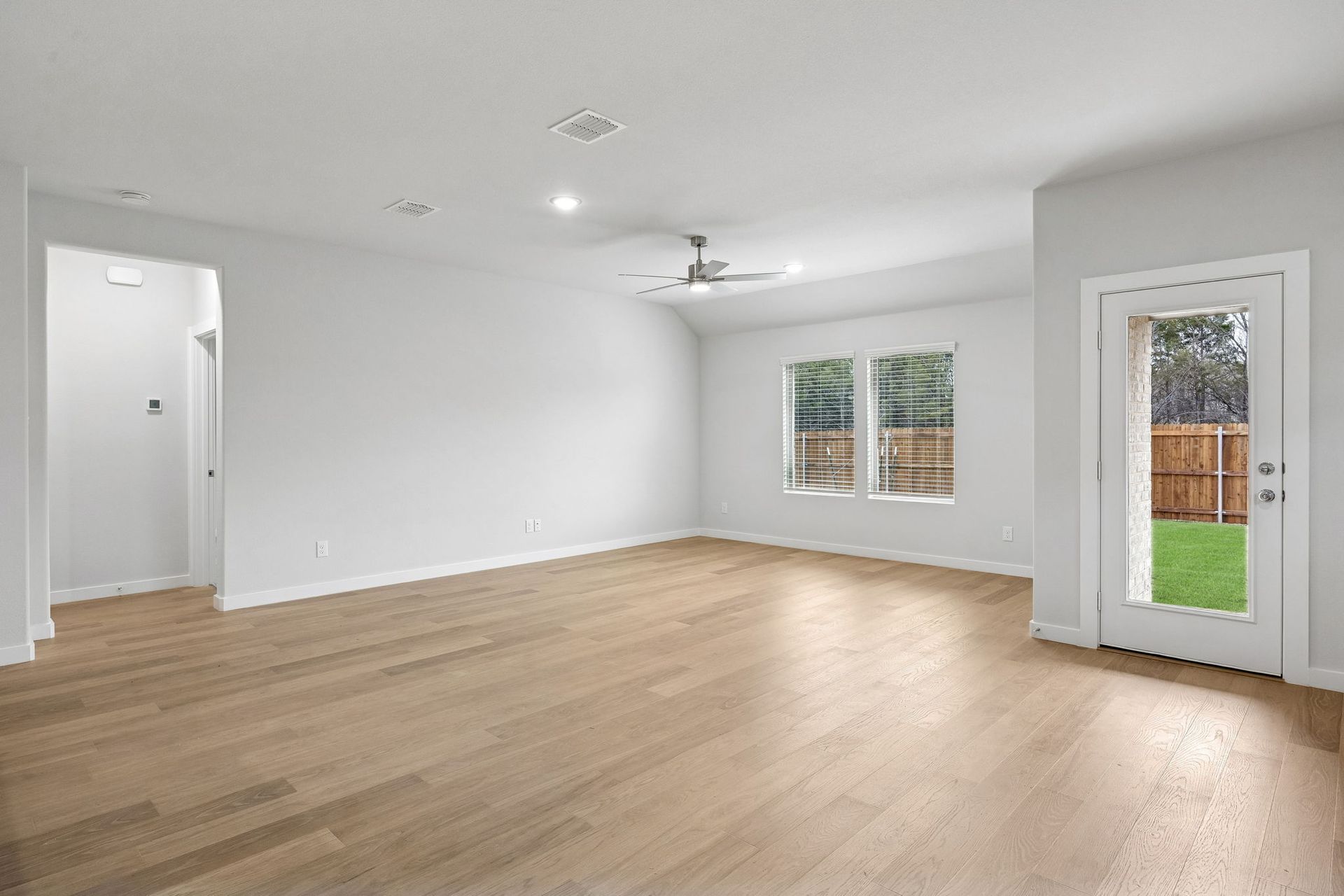 Living Area in the Heisman home plan by Trophy Signature Homes - REPRESENTATIVE PHOTO