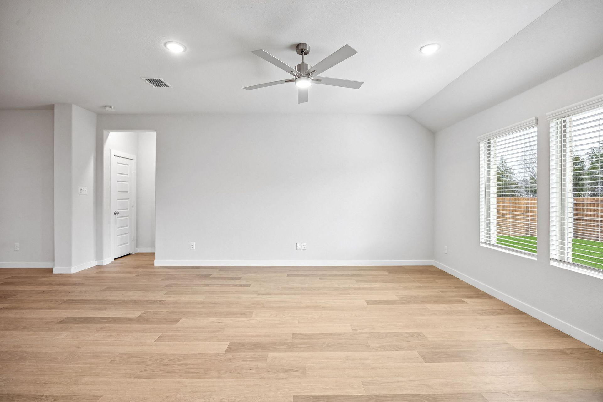 Living Room in the Heisman home plan by Trophy Signature Homes - REPRESENTATIVE PHOTO