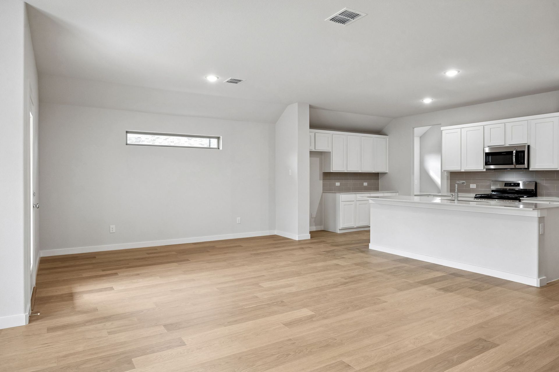 Living Area in the Heisman home plan by Trophy Signature Homes - REPRESENTATIVE PHOTO