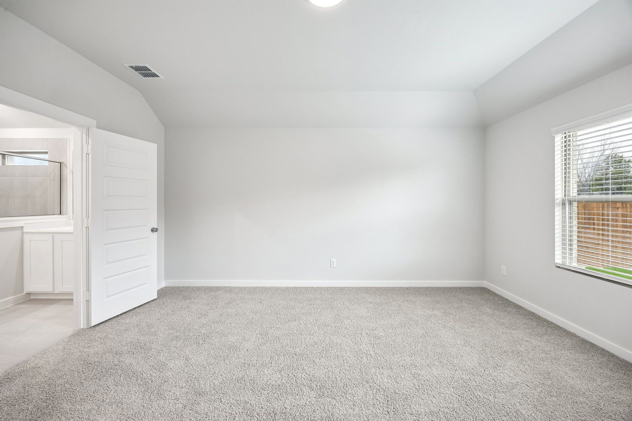 Primary Suite in the Heisman home plan by Trophy Signature Homes - REPRESENTATIVE PHOTO