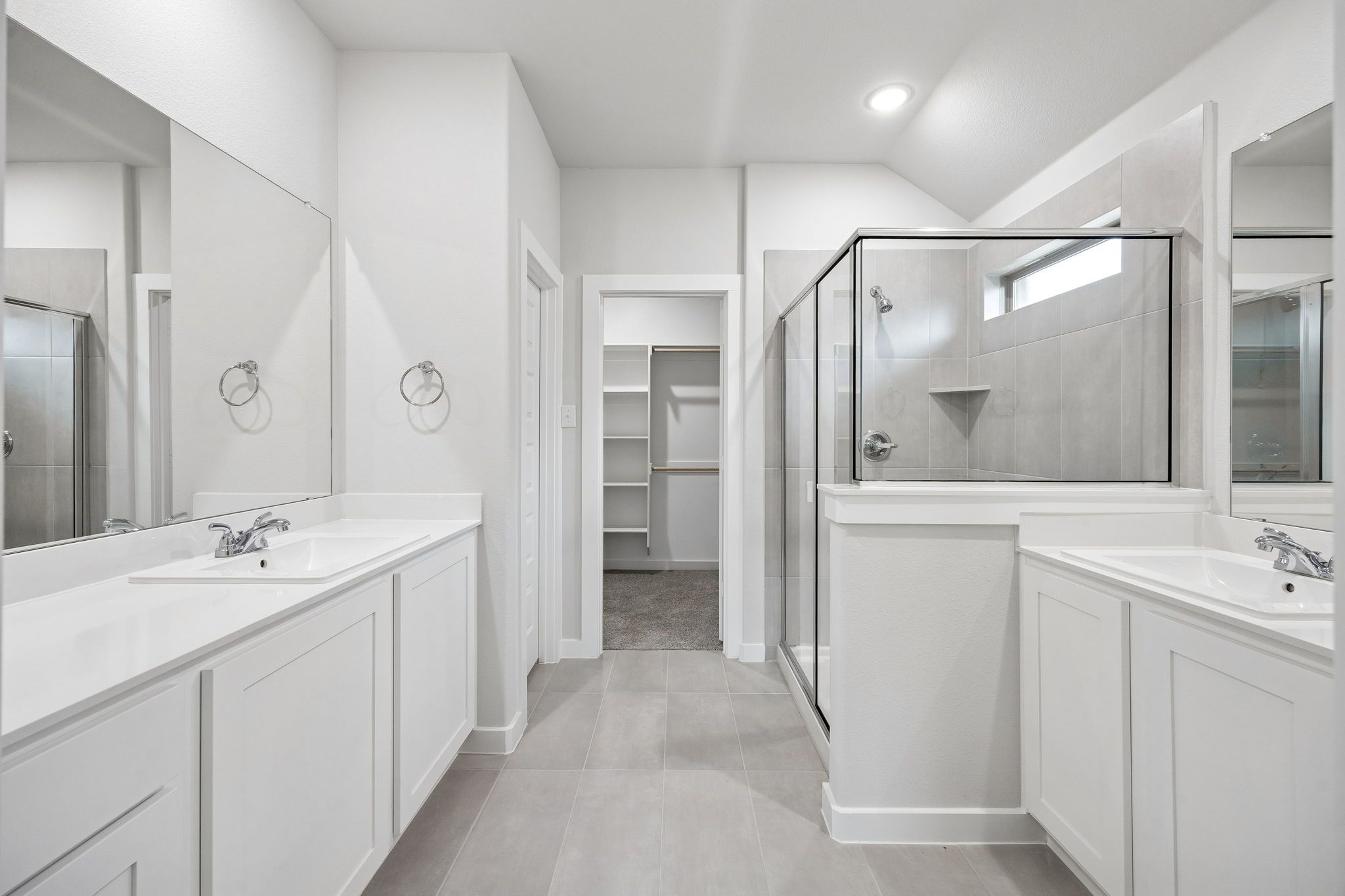 Primary Bathroom in the Heisman home plan by Trophy Signature Homes - REPRESENTATIVE PHOTO